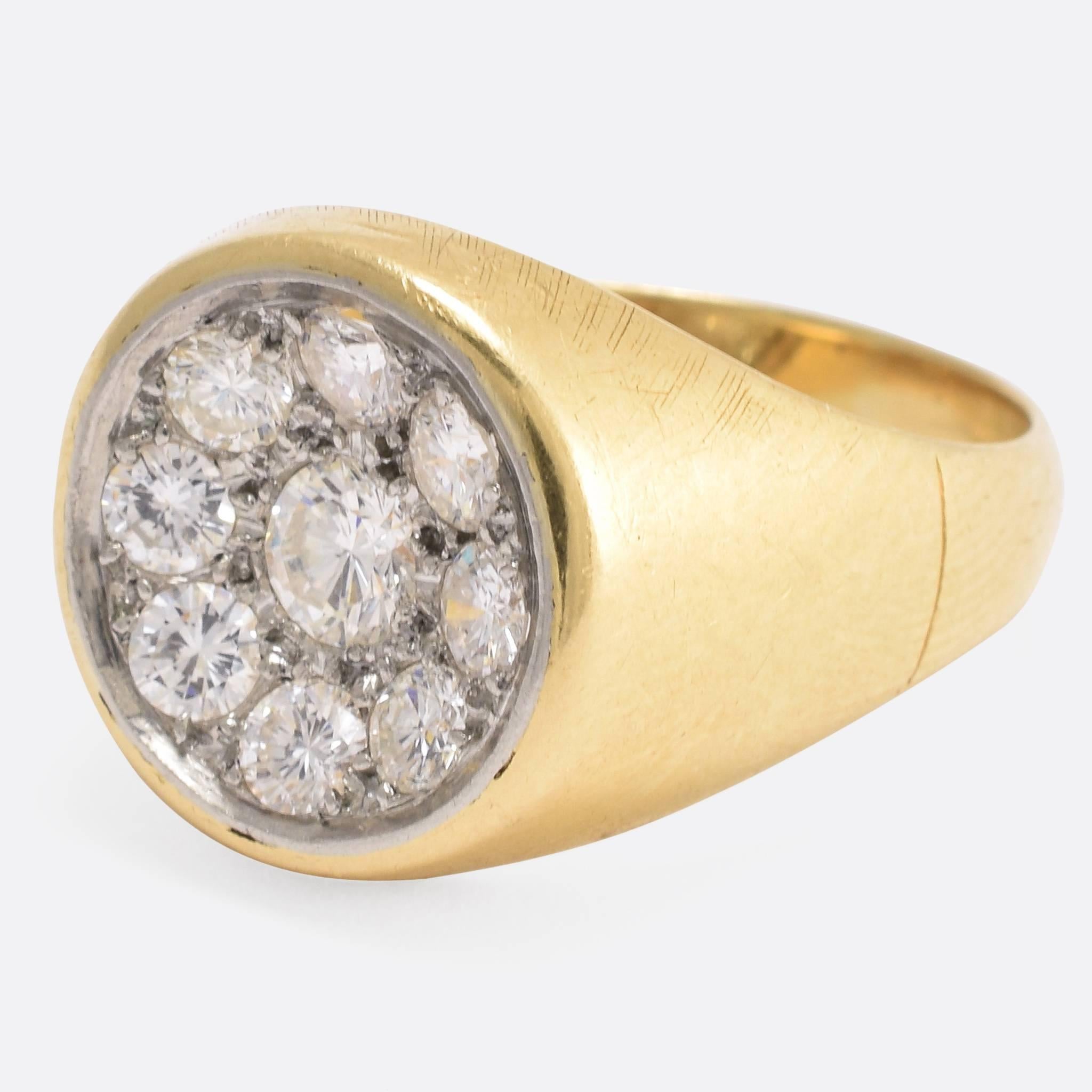 This stylish cluster ring is set with nine brilliant cut diamonds totalling .76ct weight. Of French origin, the round head is modelled in white gold creating a gorgeous two-tone effect, and rather unusually it's modelled in a concave shape - not