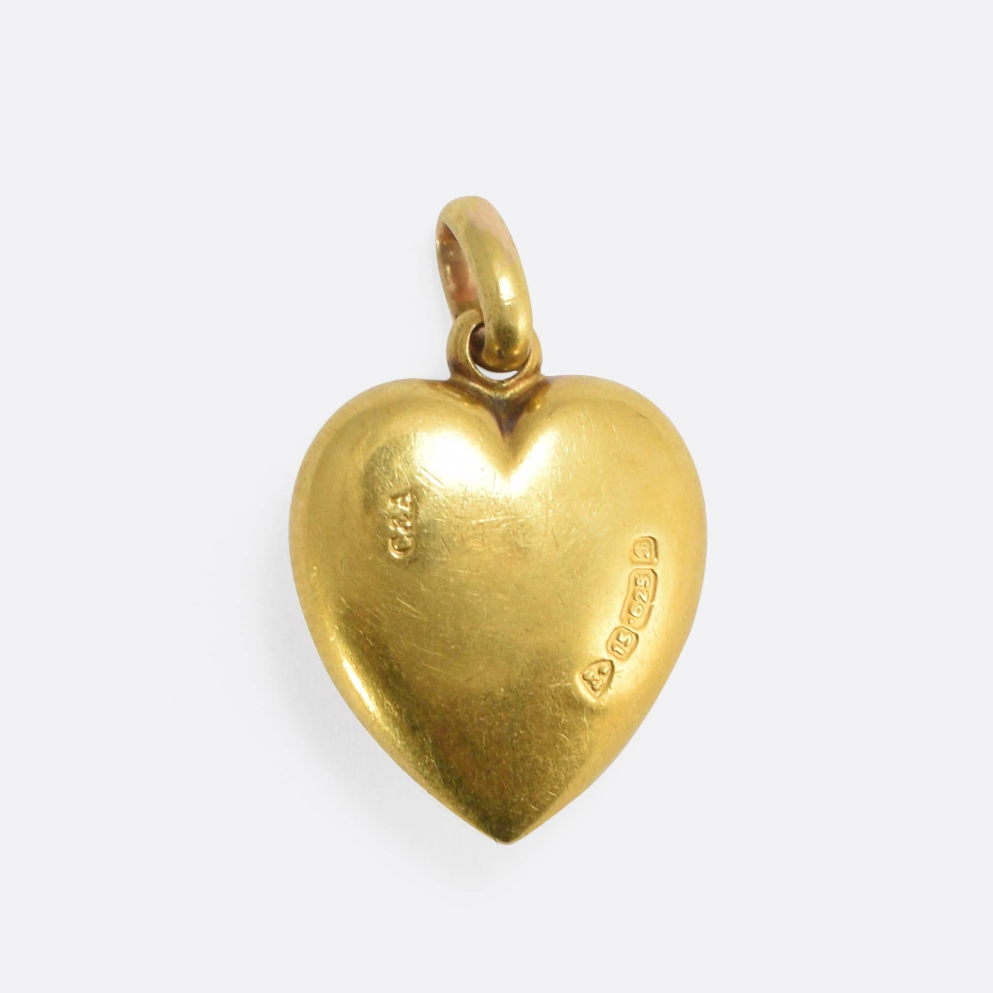 This cute antique pendant is modelled as a puffed heart, and set with a gorgeous turquoise cabochon in a central star motif. With clear English hallmarks for 15k gold, the piece is technically of the Edwardian era - but very much in the Victorian