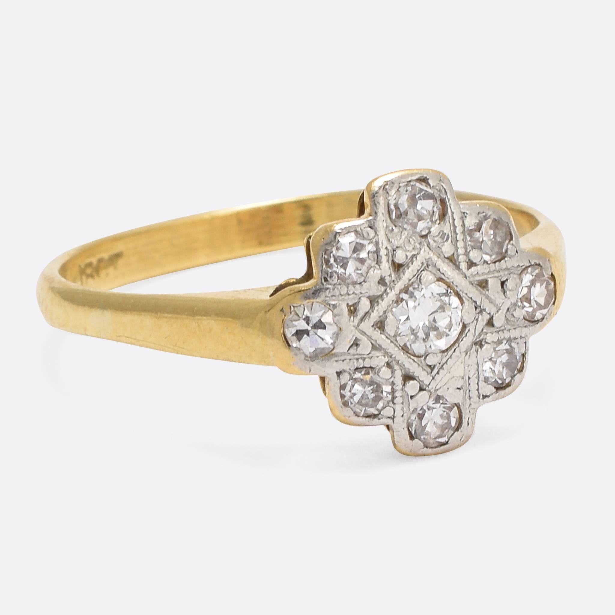 This cool vintage cluster ring is set with nine eight-cut diamonds, in detailed platinum mounts. The band is modelled in 18k yellow gold, while the head features a stylish millegrain cross motif. An elegant ring, full of Art Deco character.  Ring