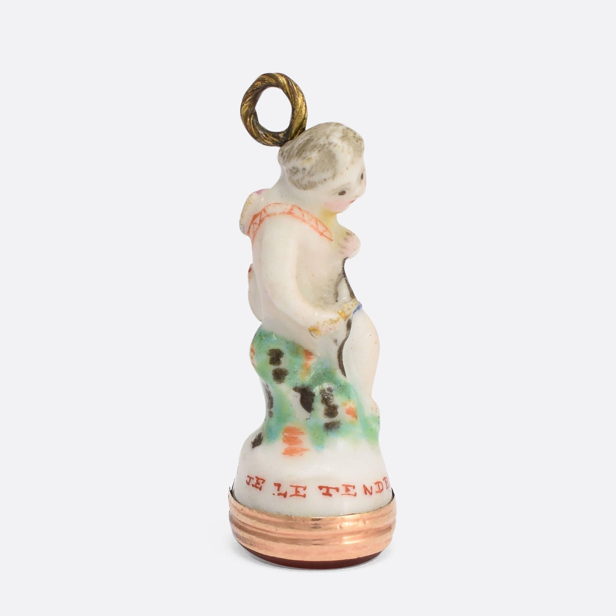 An original 18th Century porcelain Derby Chelsea period fob seal. This particular piece features Cupid holding his bow, with arrow quiver slung over one shoulder, and displays the pale colouring typical of the Chelsea factory. The intaglio carved