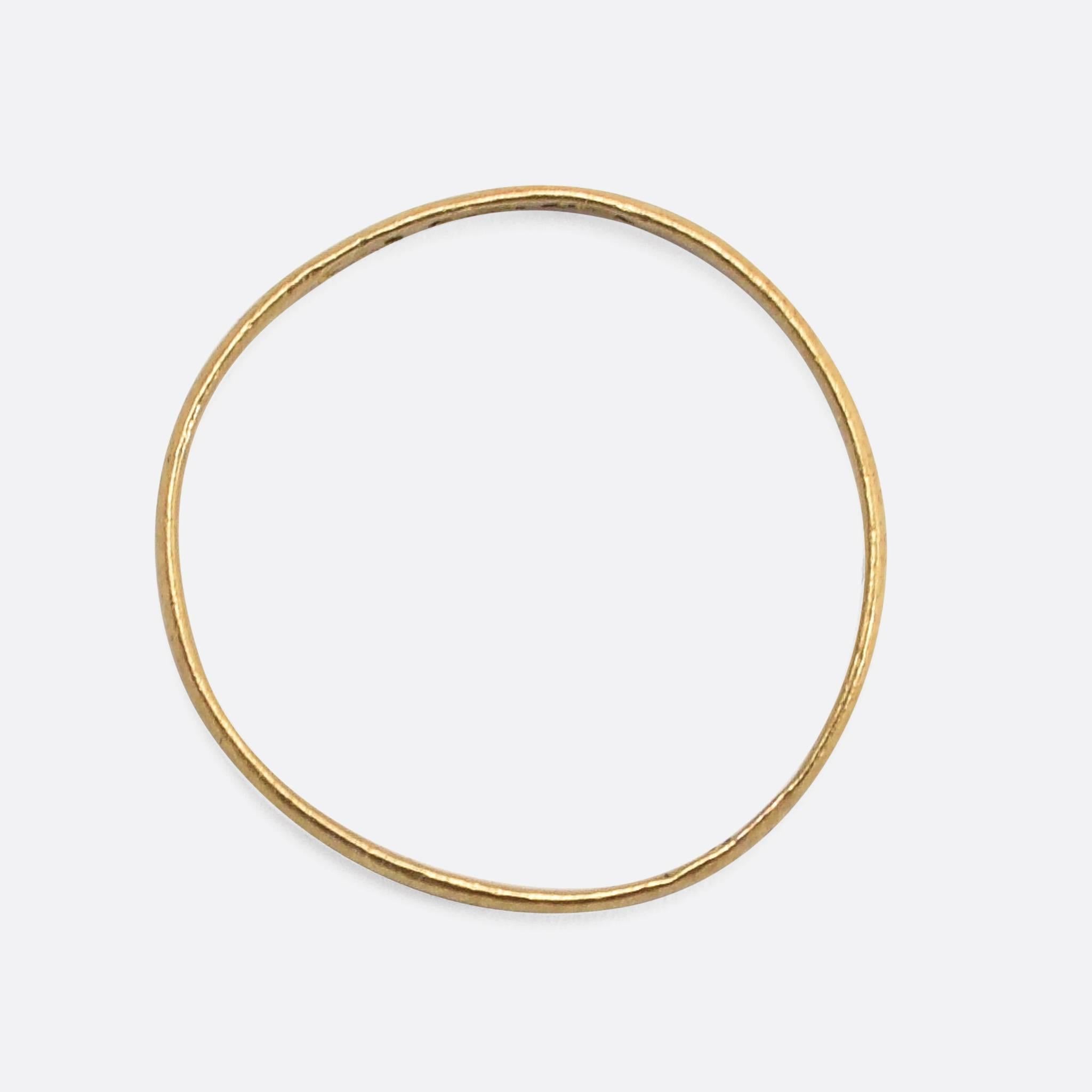 The slim antique wedding band dates to the very beginning of the 19th Century, when King George III sat on the throne. It's modelled in rich 18 karat gold, with English hallmarks. These early wedding rings are becoming increasingly harder to find,