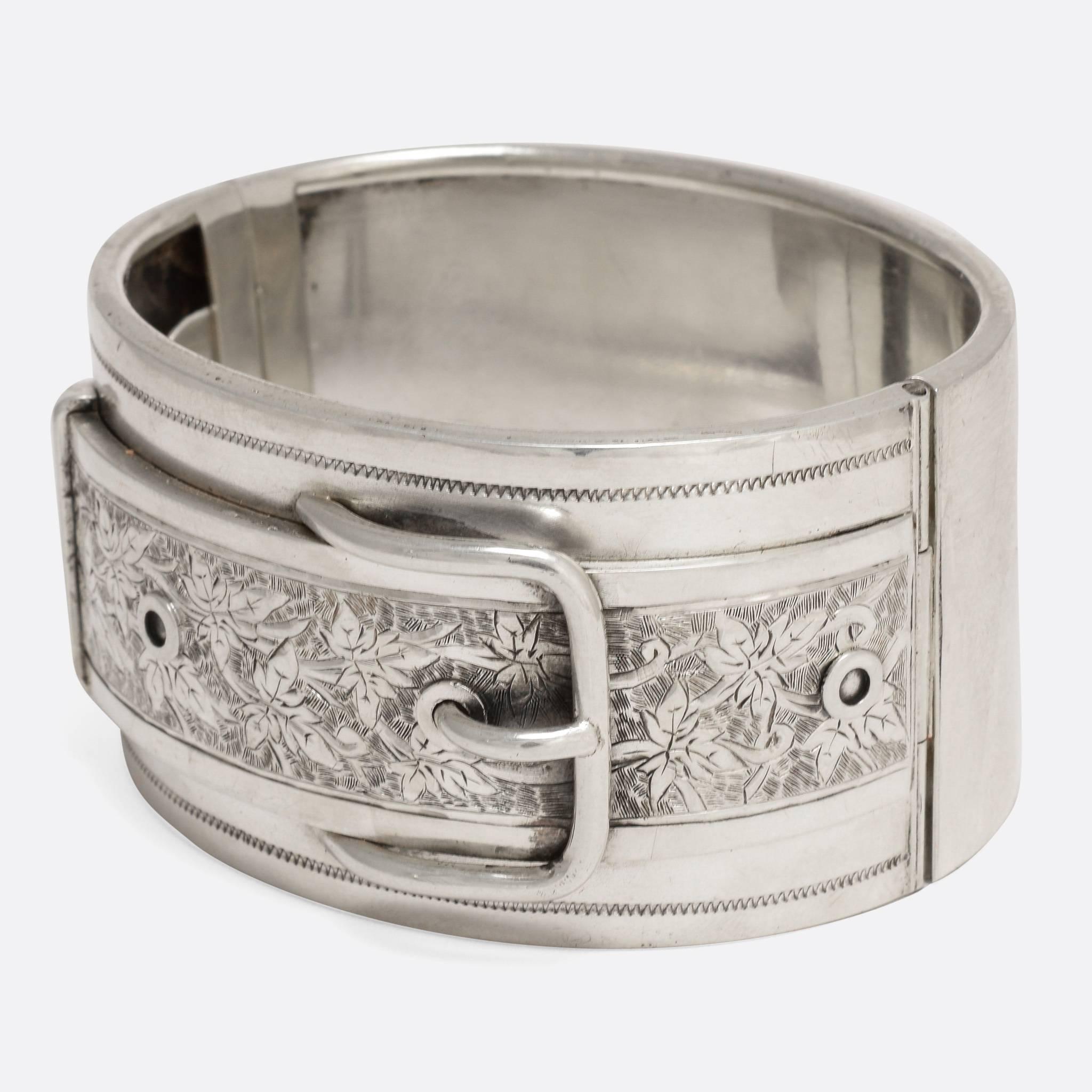 This stylish antique bangle features a Belt Buckle design, finished with fine hand-chased detailing with Ivy Leaf motifs. Both the buckle and the ivy leaf are classic examples of Victorian sentimental symbolism - where certain motifs were known to