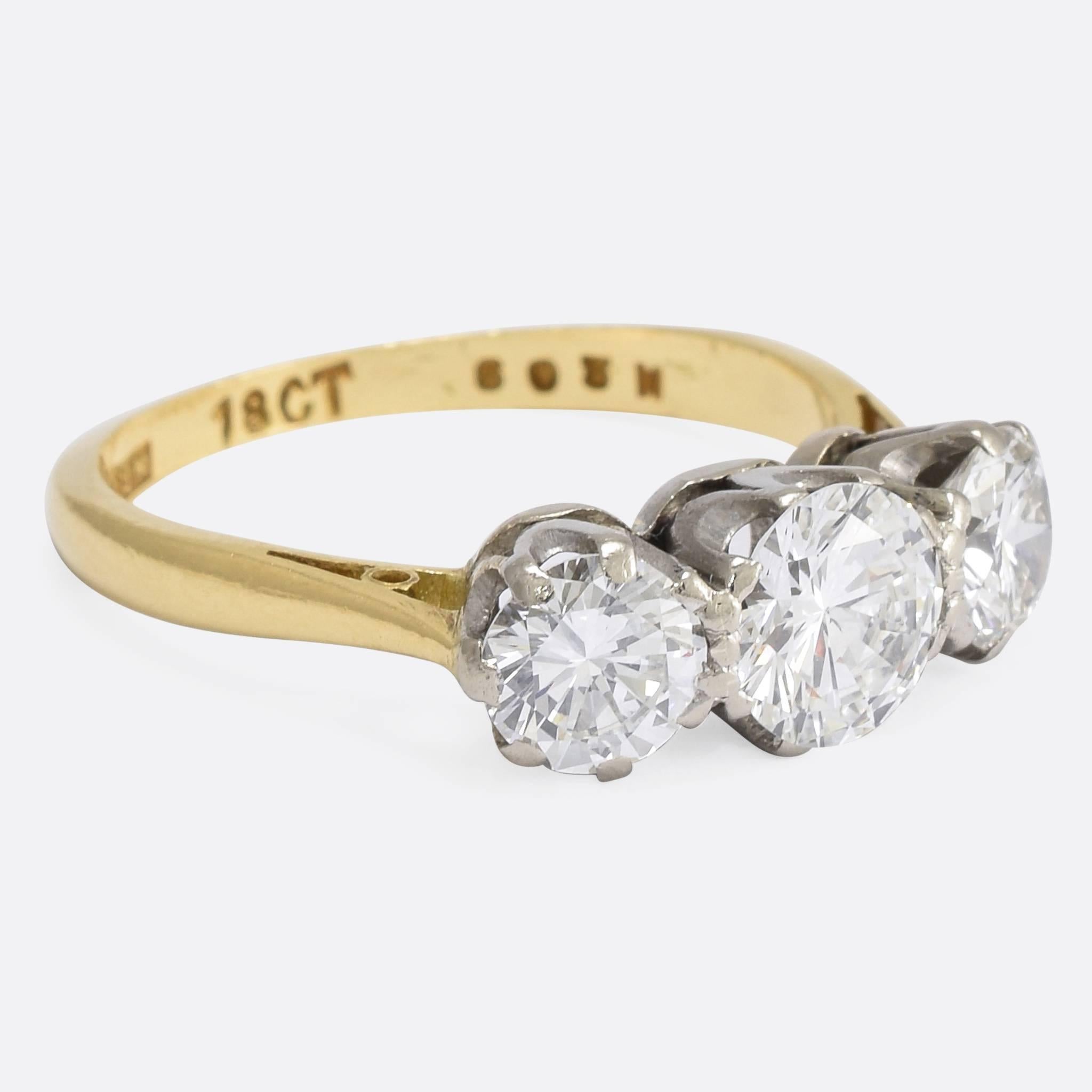 This superb Art Deco Trilogy ring is set with three brilliant cut diamonds, of excellent clarity and colour, with a total weigh of 1.82 carats. It's modelled in 18k gold with platinum settings, wonderfully proportioned with exceptionally good