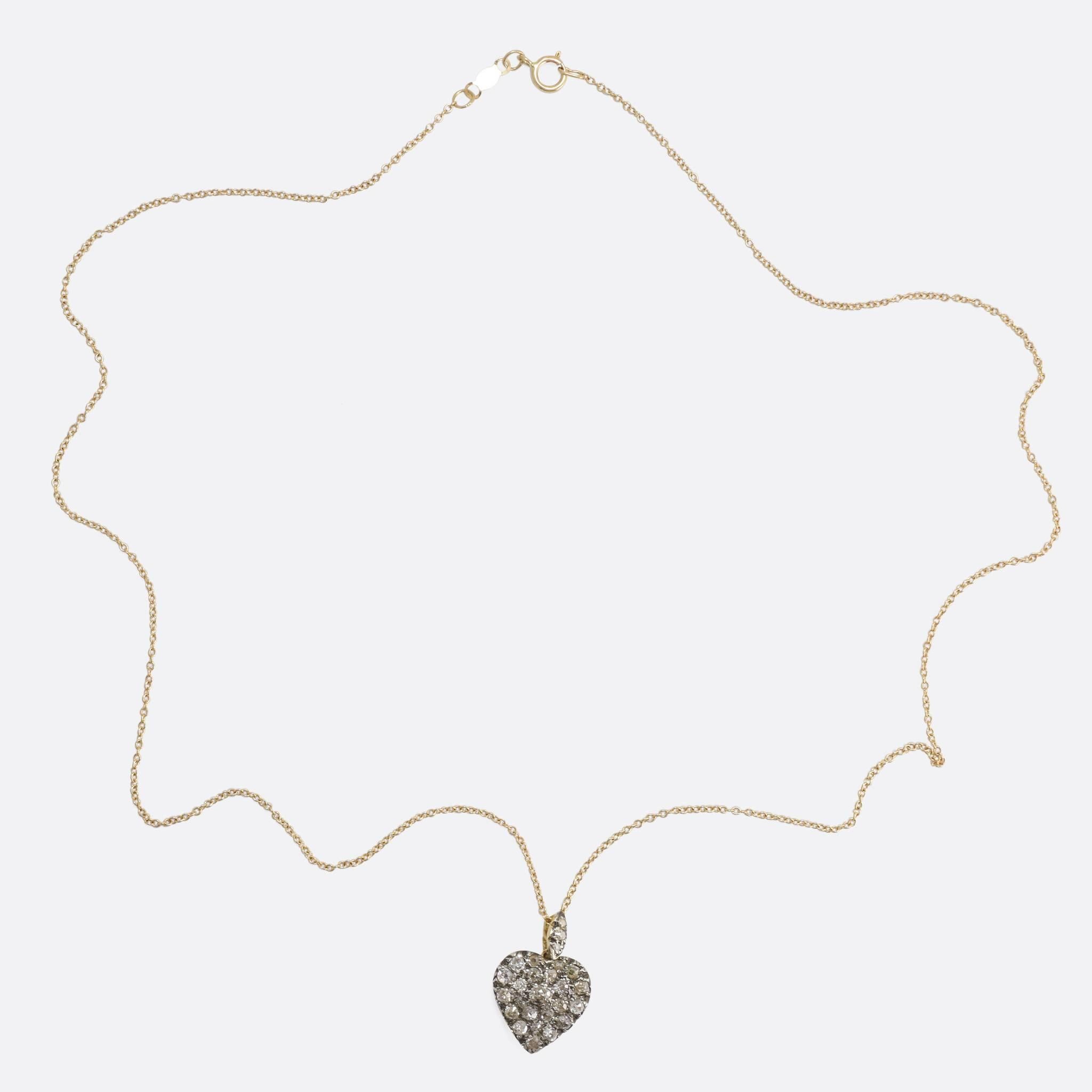 This beautiful Heart Pendant dates to c.1880, pavé set with old cut diamonds. Pavé translates literally as 