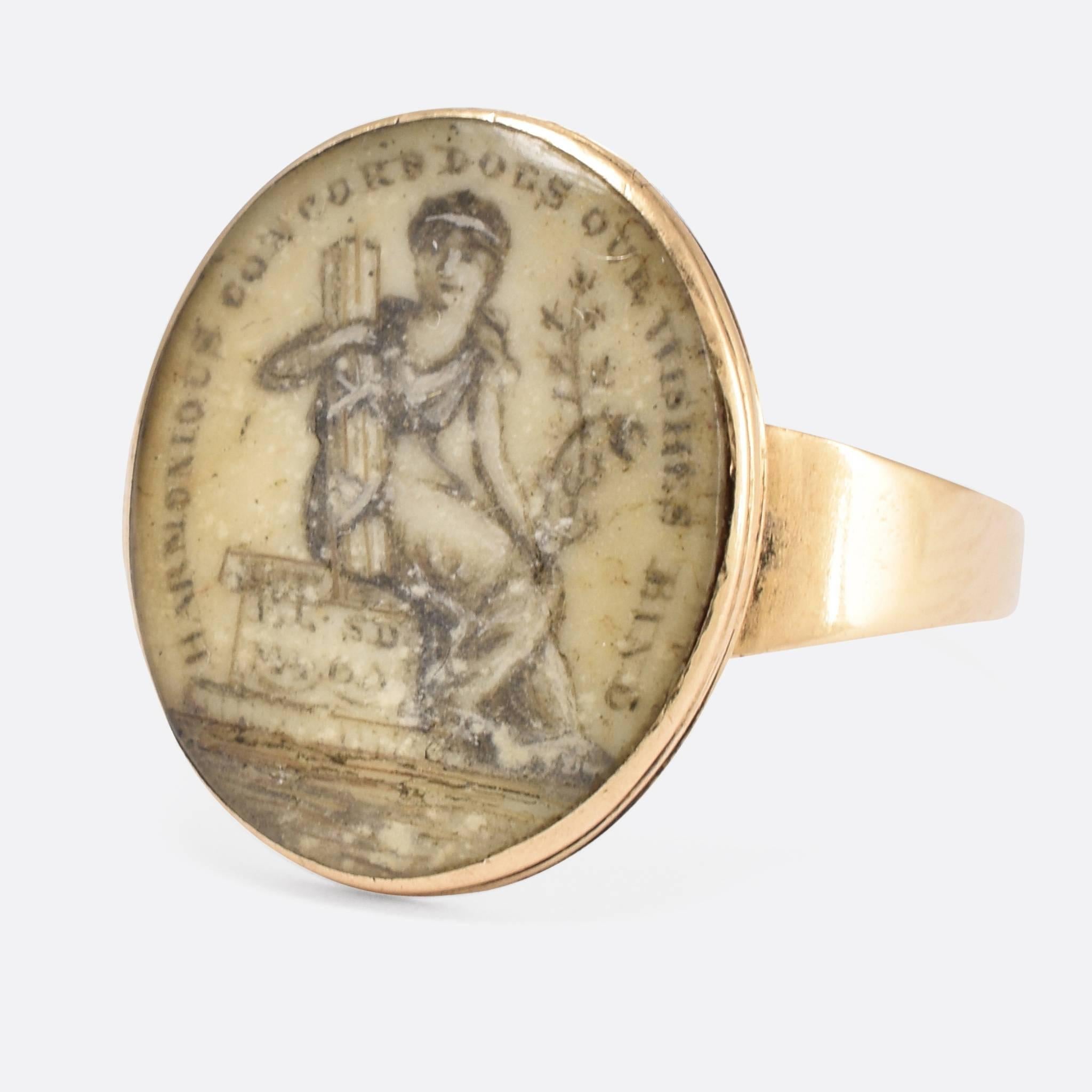 A sweet 18th Century Sepia miniature Mourning ring modelled in 15ct gold, the subject depicted sitting beside a plinth that reads 