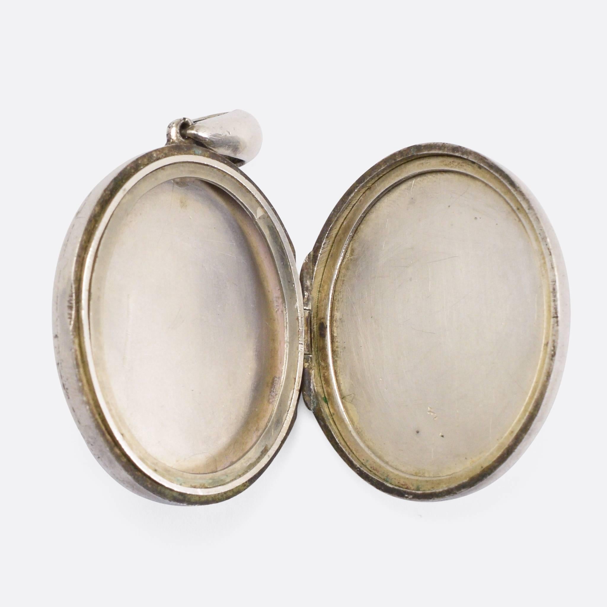 An attractive late Victorian sterling Silver locket, with applied Japanesque detailing, so typical of the Aesthetic movement of the same period.