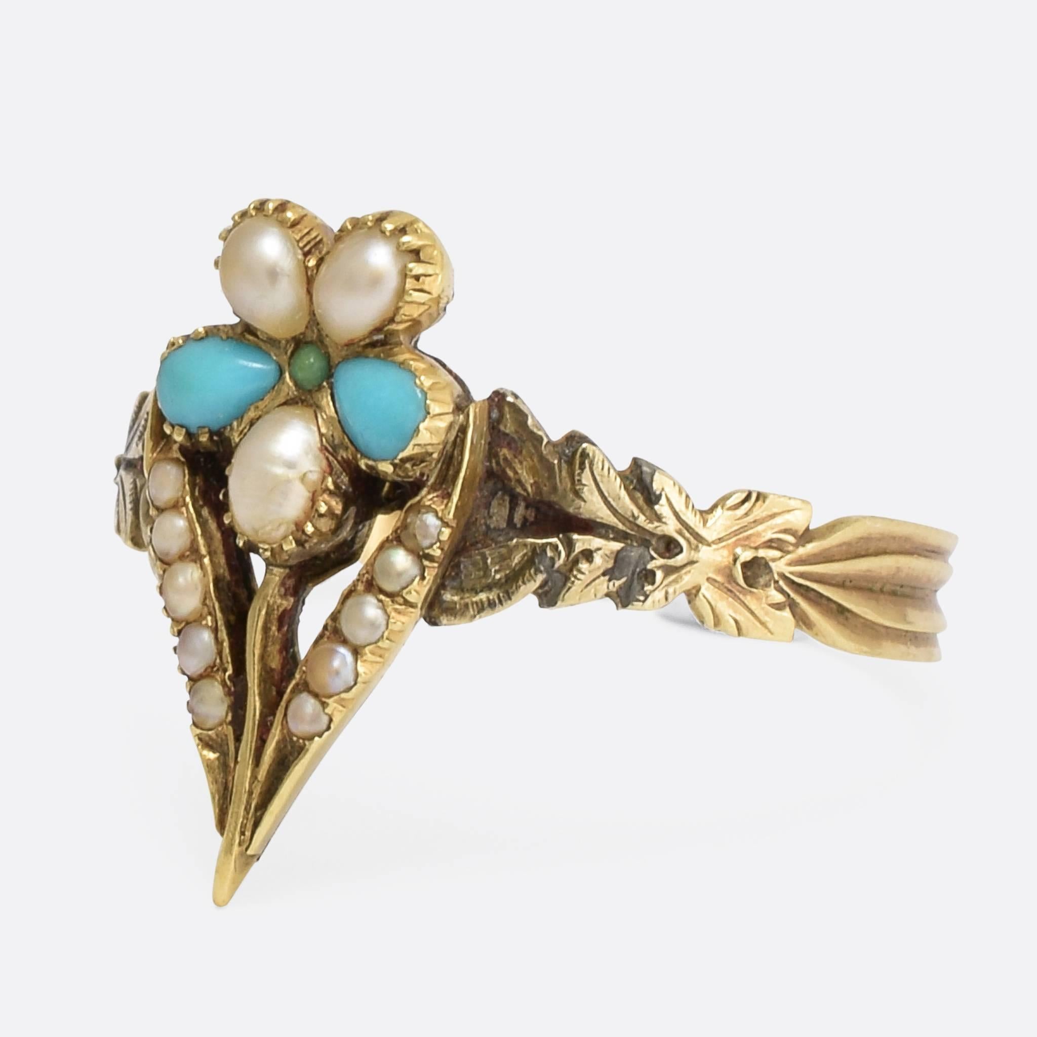 This beautiful Pansy flower ring was made during the Regency Period at the beginning of the 19th Century. The flower is set with three natural pearls, and three turquoise cabochons (including one tiny tiny turquoise in the centre). The leaves are