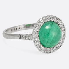 1920s Art Deco Emerald Cabochon Diamond Halo Ring