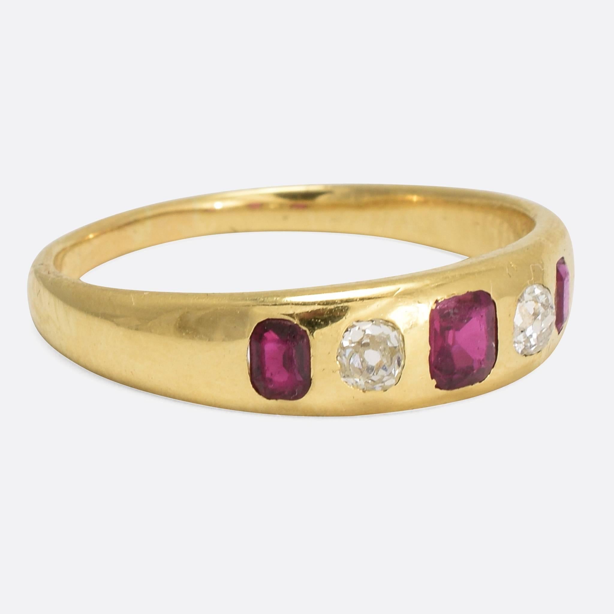 This classic late Victorian gypsy ring is set with three rectangular rubies and two old cut diamonds (total diamond weight approx. 0.36ct). Ideal for stacking, the band gradually widens towards the head, modelled in rich 18k yellow gold throughout.