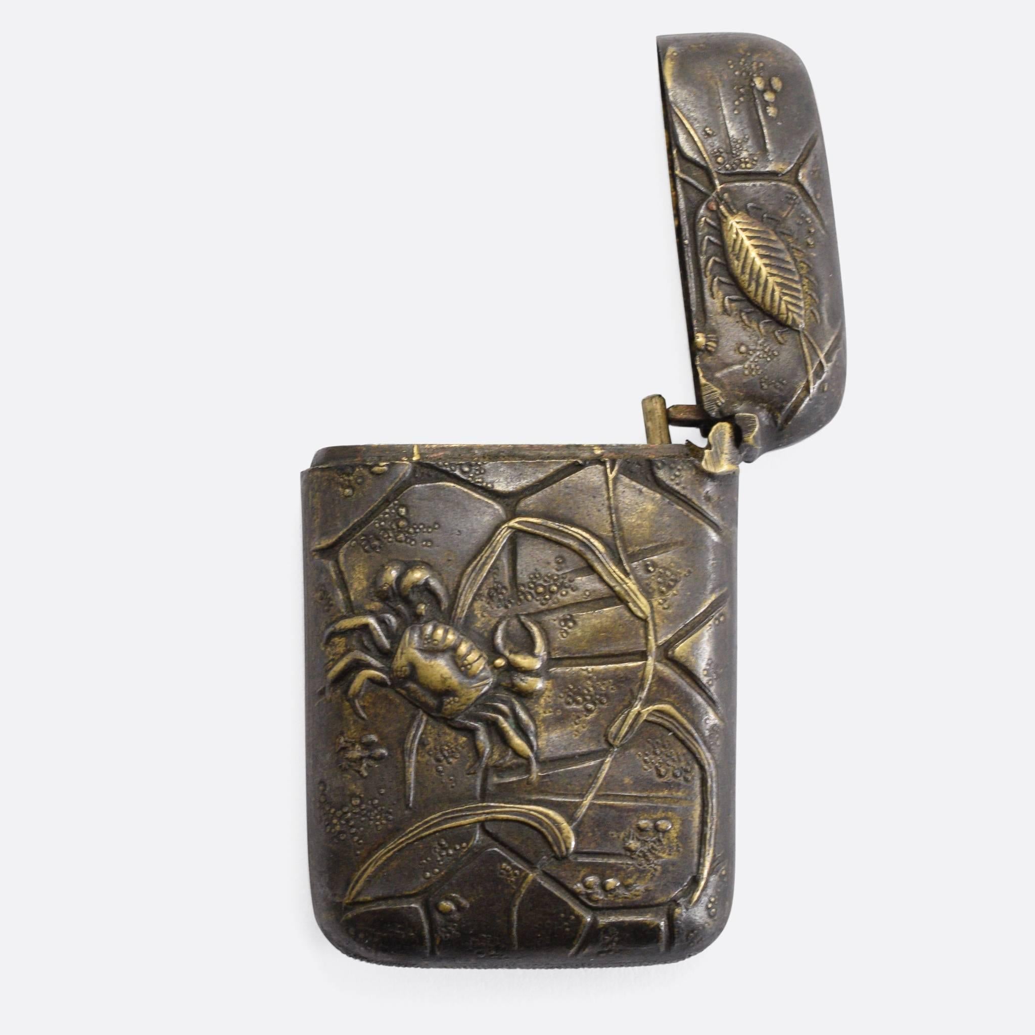 A fine example of Japanese Mokume-gane mixed metalwork. This vesta case is decorated with crabs and other sea creatures - in relief - above a kind of 