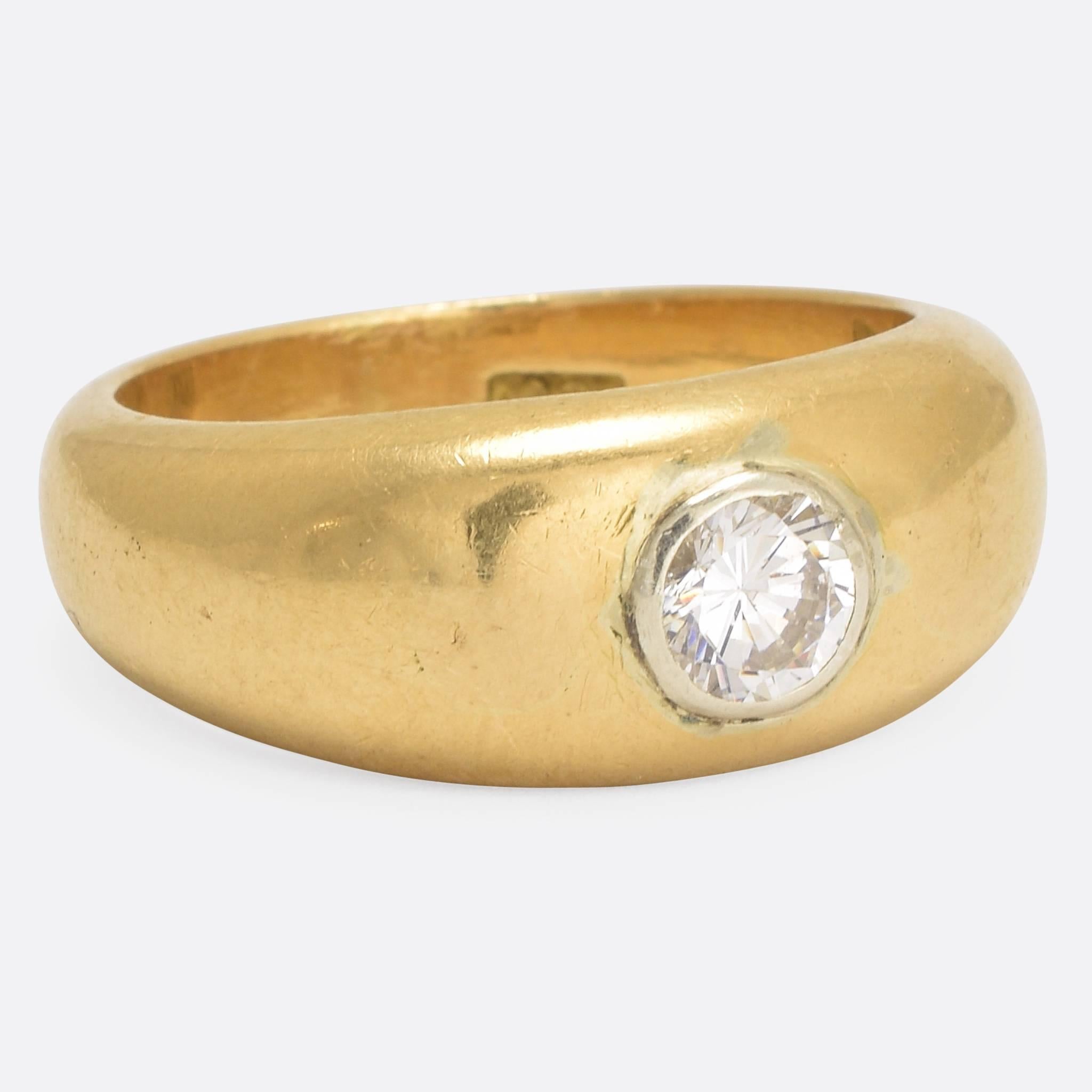 A particularly high quality 18k gold single stone band, the VS clarity 50pt stone, of high colour, -approx G - in a platinum collet setting. The ring weighs 16 grams with a very substantial feel. Ring size: 9.5.