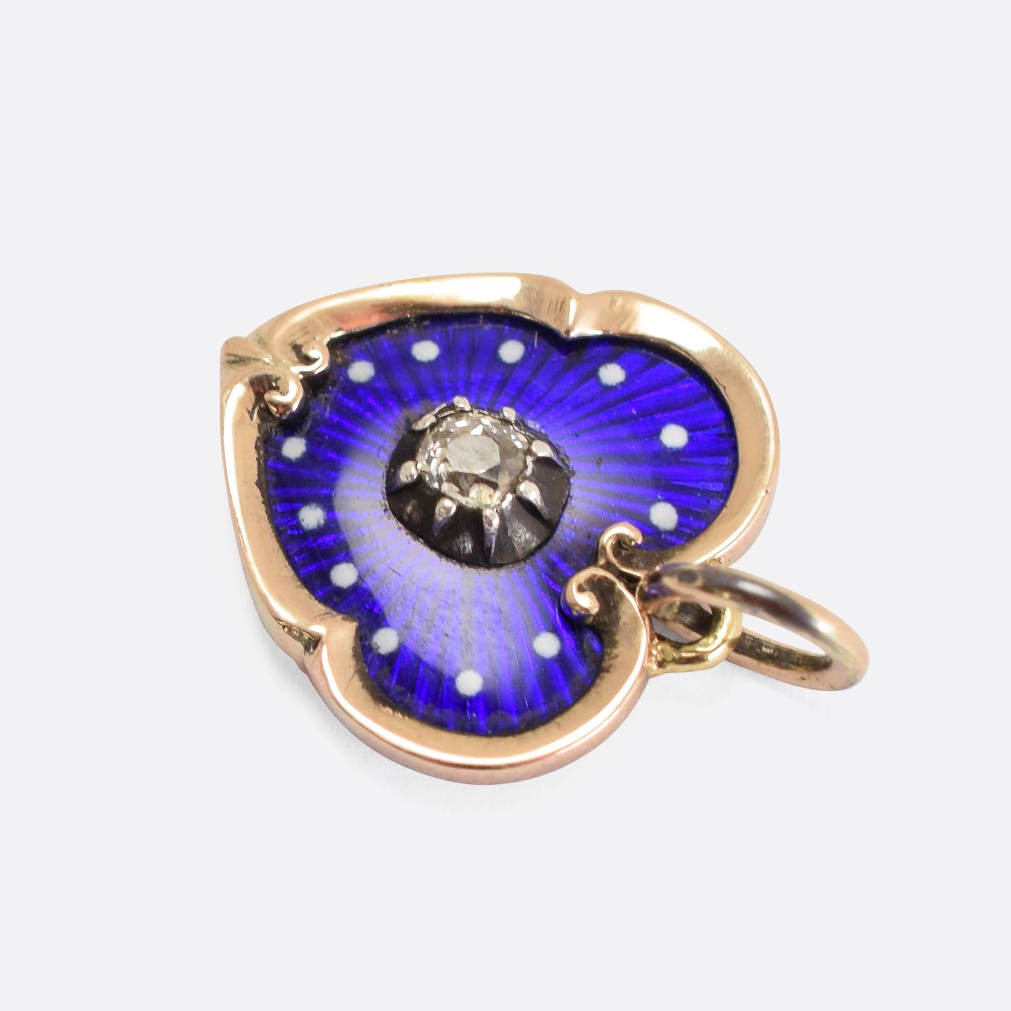 The sweet 15k gold shaped heart is set with guilloché blue enamel and a central cushion cut diamond in a cut back Georgian type collet setting. 