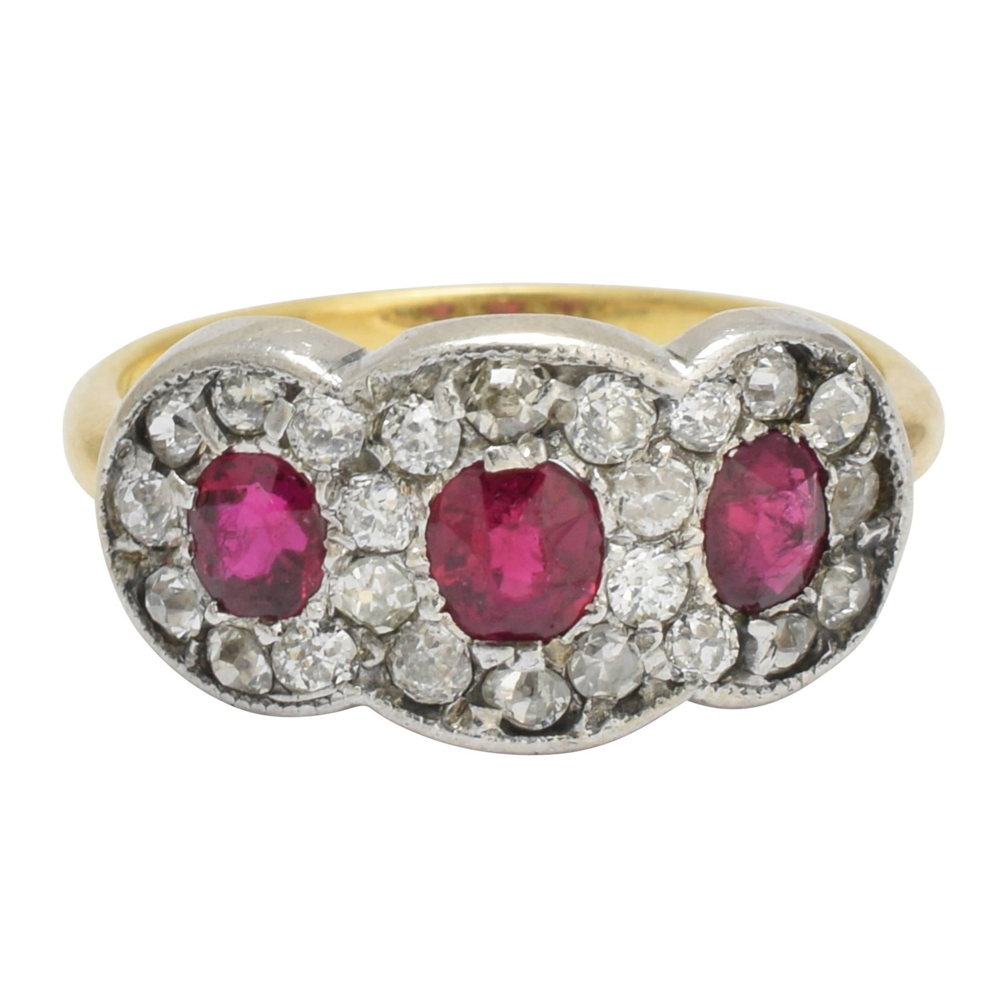 Edwardian Ruby and Diamond Three-Stone Halo Ring