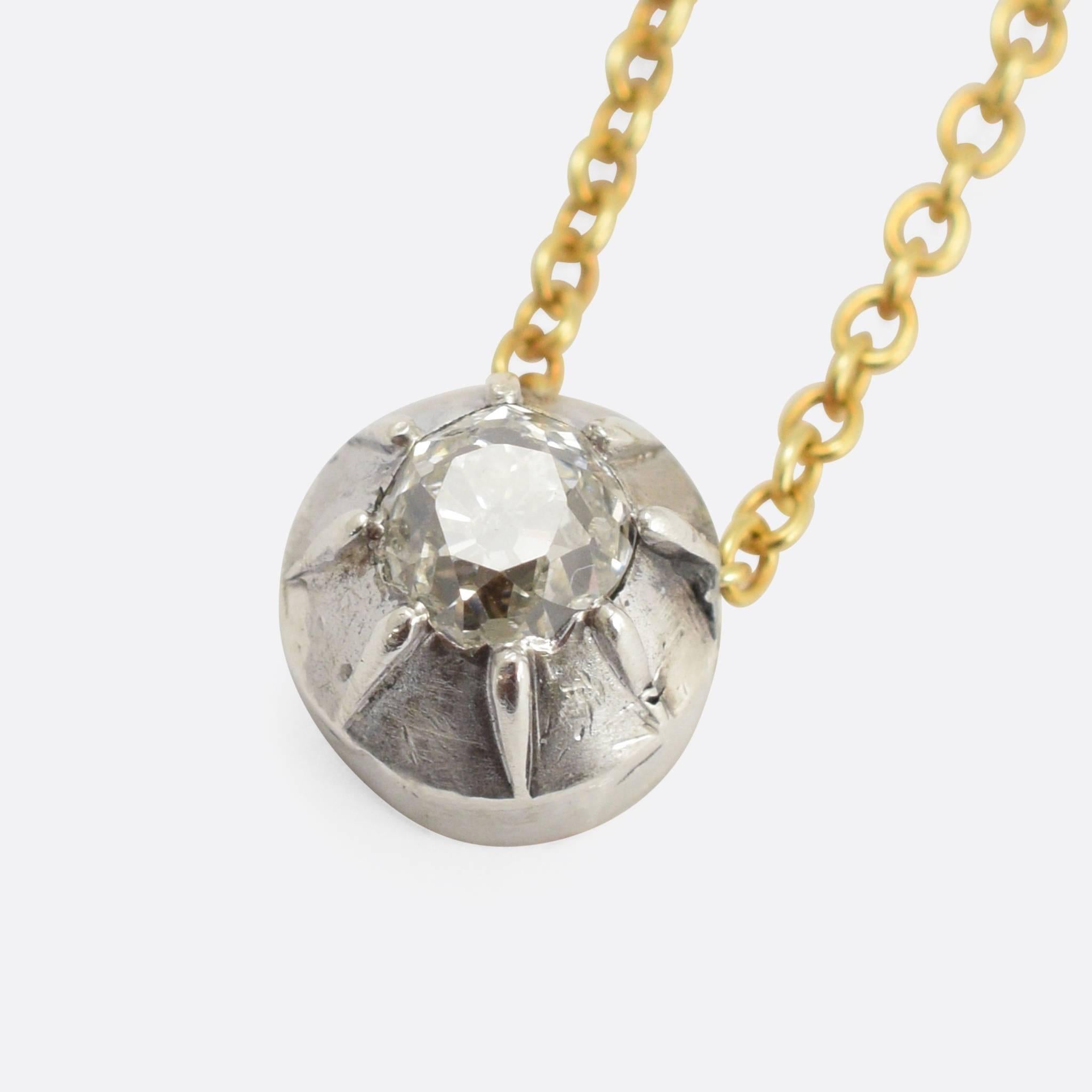 A stylish and understated diamond pendant, converted from a Georgian era brooch. The setting is modelled in sterling Silver, and features a typical early 19th Century claw mount - home to a beautiful old mine cut diamond. We have paired it with a