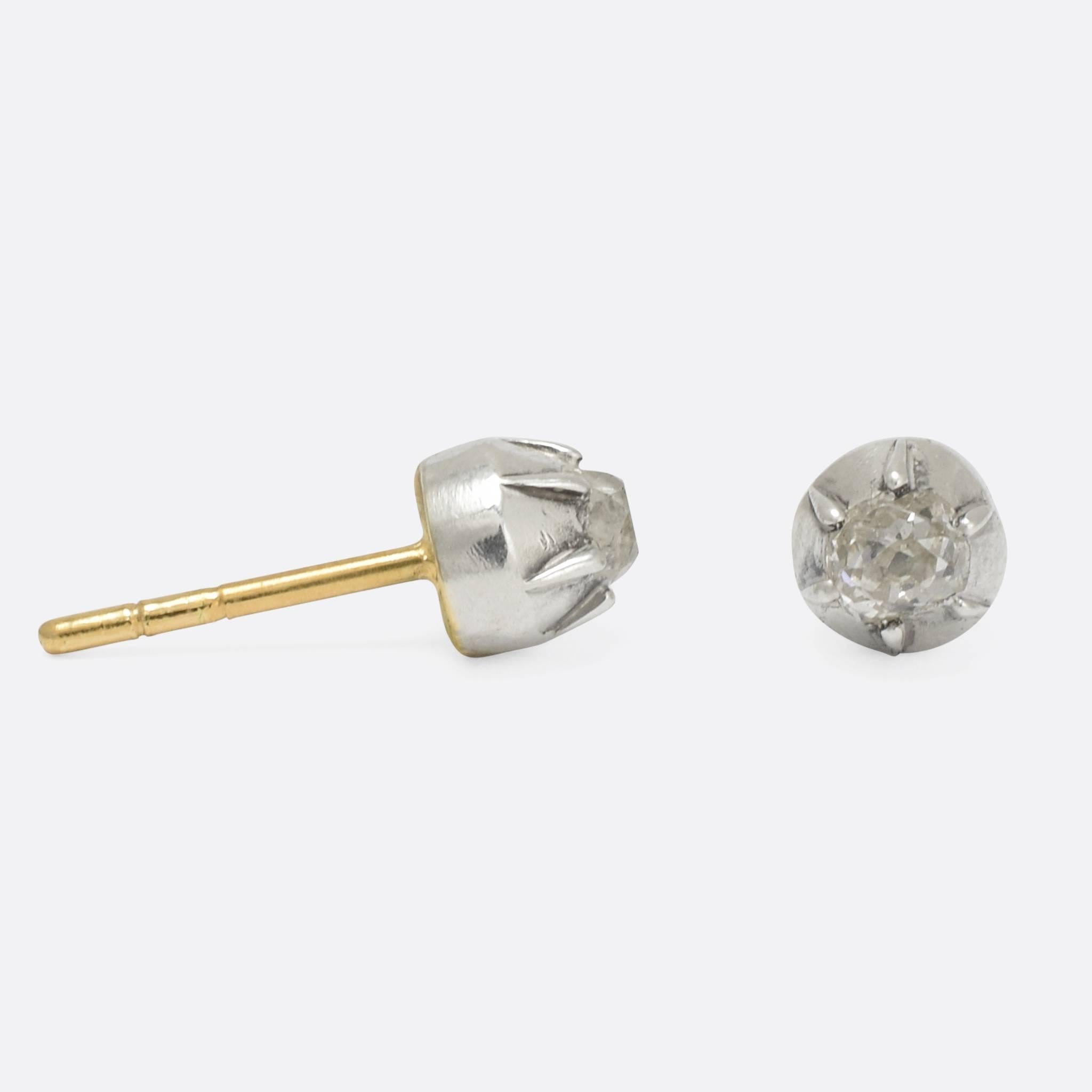 A sweet pair of Georgian stud earring conversions, each set with a .15ct old mine cut diamond in silver claw settings typical of the period. We have added 9k gold posts with butterfly backs. They were originally part of a larger Georgian era brooch.