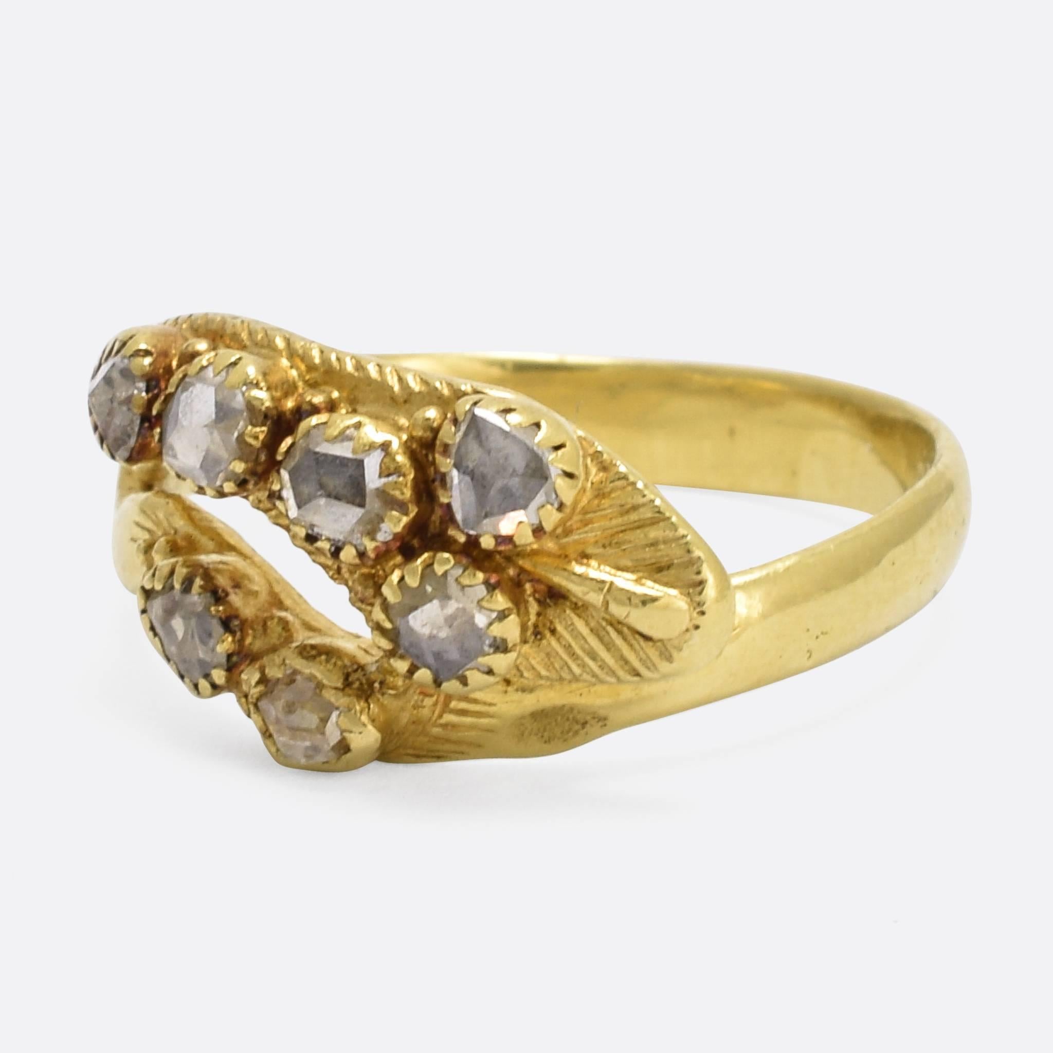 A late 18th Century snake ring, set with rose cut diamonds. It dates to c.1780, modelled in 18k yellow gold, with wonderful hand-chased textures and detailing. A fine, and quite unusual example of this enduring style. Ring size: 6.5.