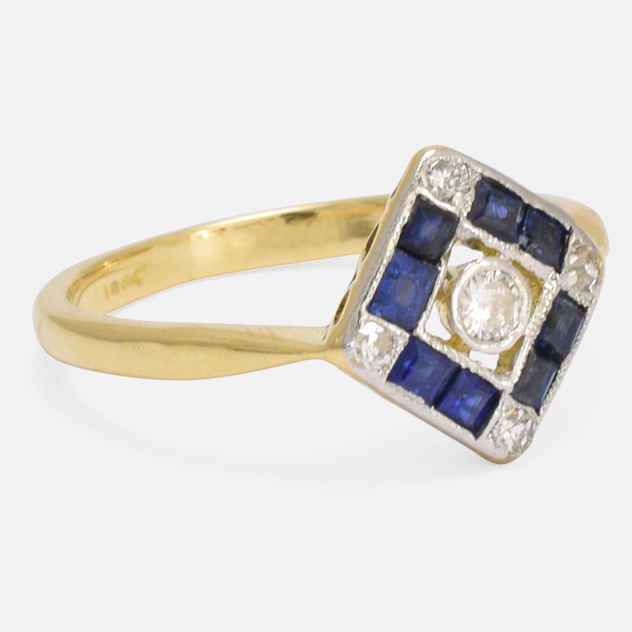 A stylish 1920s blue sapphire and diamond cluster ring, with square face and openworked gallery. The design is quintessentially Art Deco, with geometric shapes and striking use of contrast. Ring size: 6.75.