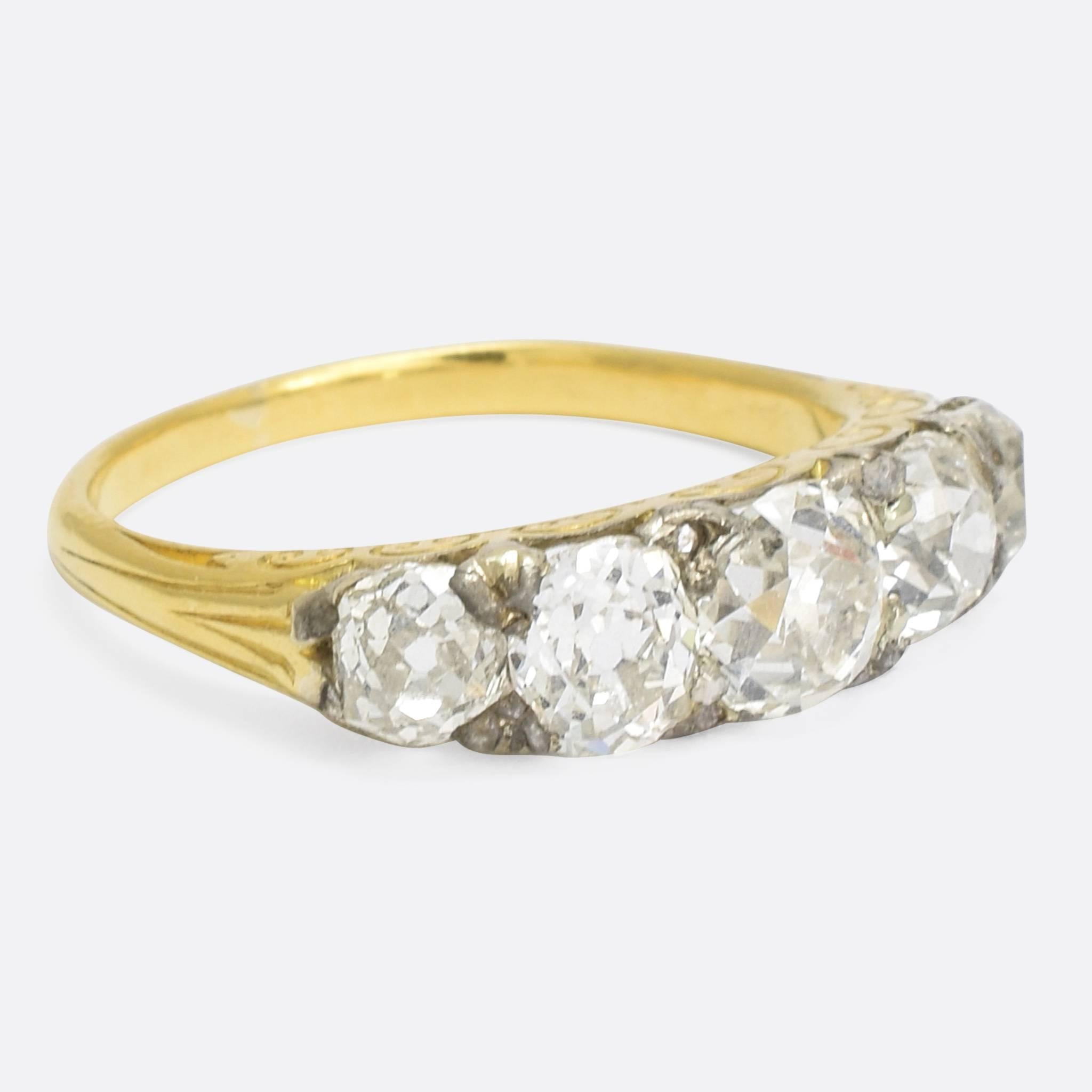 An exceptional antique diamond 5-stone band dating to the mid-Victorian era, c.1870. It's set with gorgeous cushion cut diamonds - just over 2 carats in total - and modelled in 18k gold with silver settings. The gallery features pretty scrolled