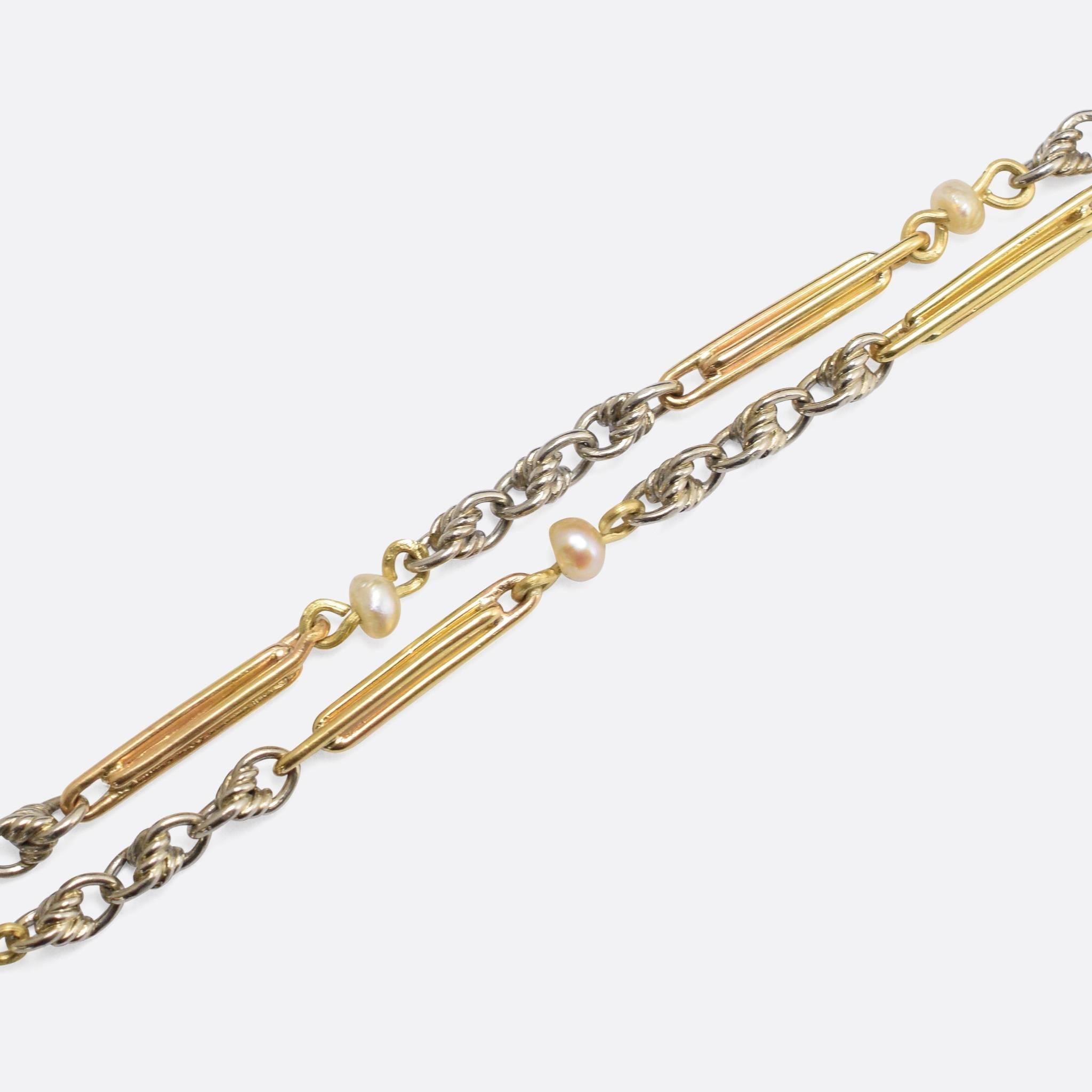 A wonderful antique chain, set with 12 baroque pearls and modelled in alternating 18k gold and platinum sections. The platinum is worked into pretty twisted links, while the 18k gold links are formed into long bars.

STONES
Natural Baroque