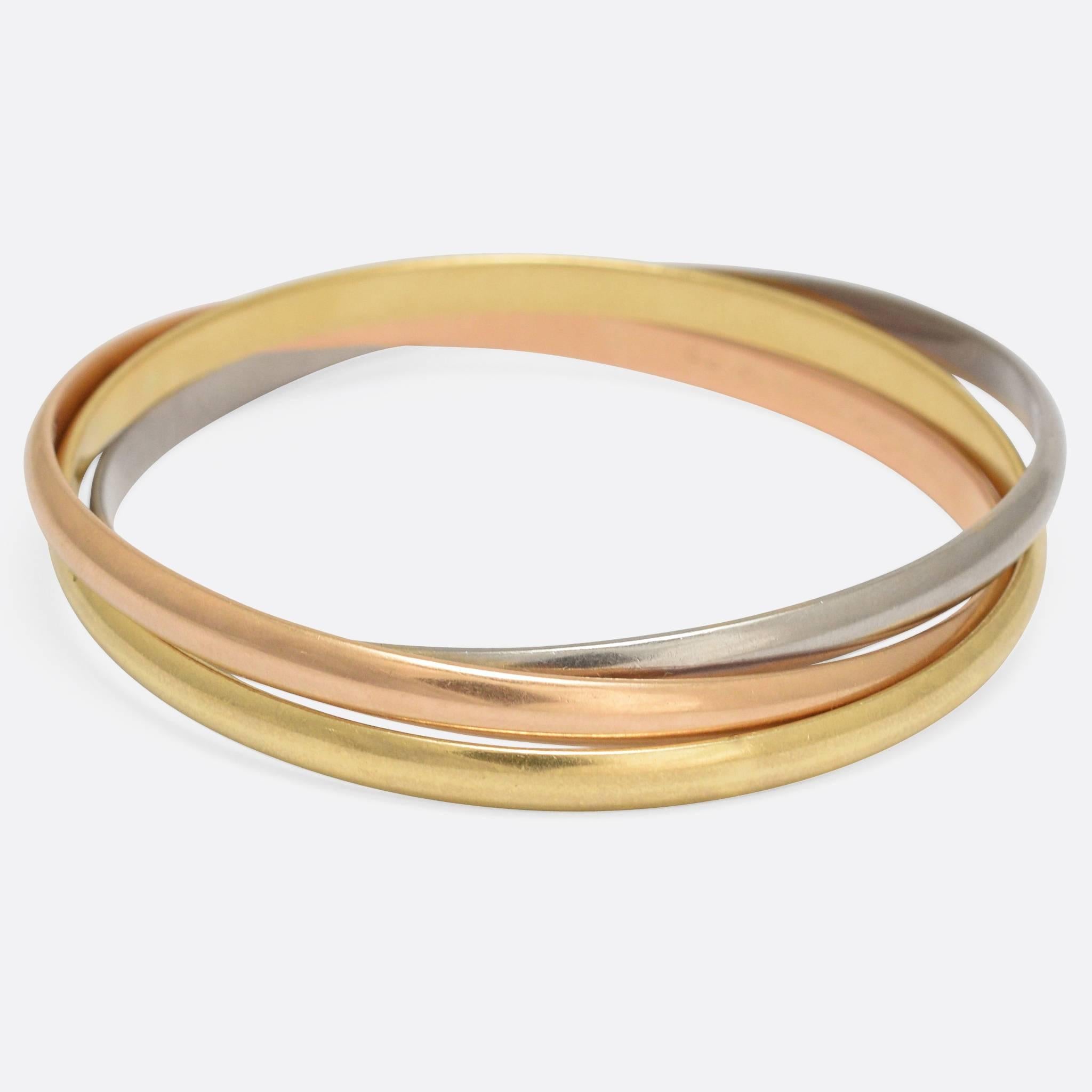 A classic set of vintage Cartier Trinity bangles, fully marked and modelled in 18k yellow, white and pink gold. They date to the 1970s, elegant and stylish, and offered in the original Cartier presentation box.

MEASUREMENTS
Inner circumference: 7