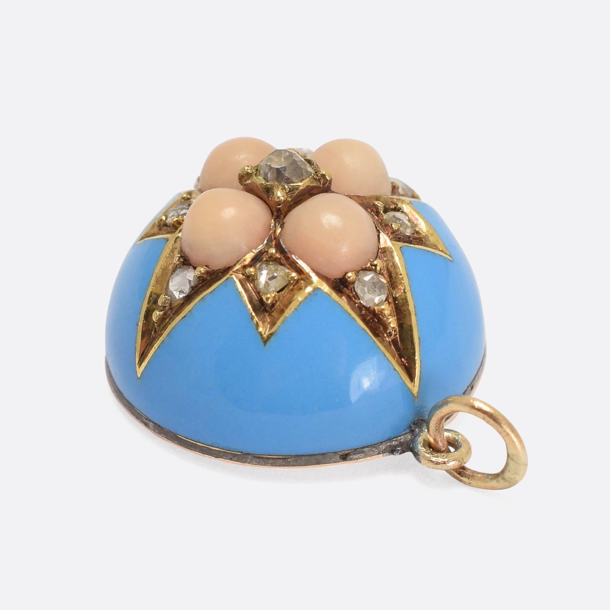 A cool Victorian pendant, set with angel skin coral and rose cut diamonds, and finished in turquoise enamel. The hemispherical design is topped with an 8-pointed star, within which the stones are clustered. It's a good wearable size (3/4