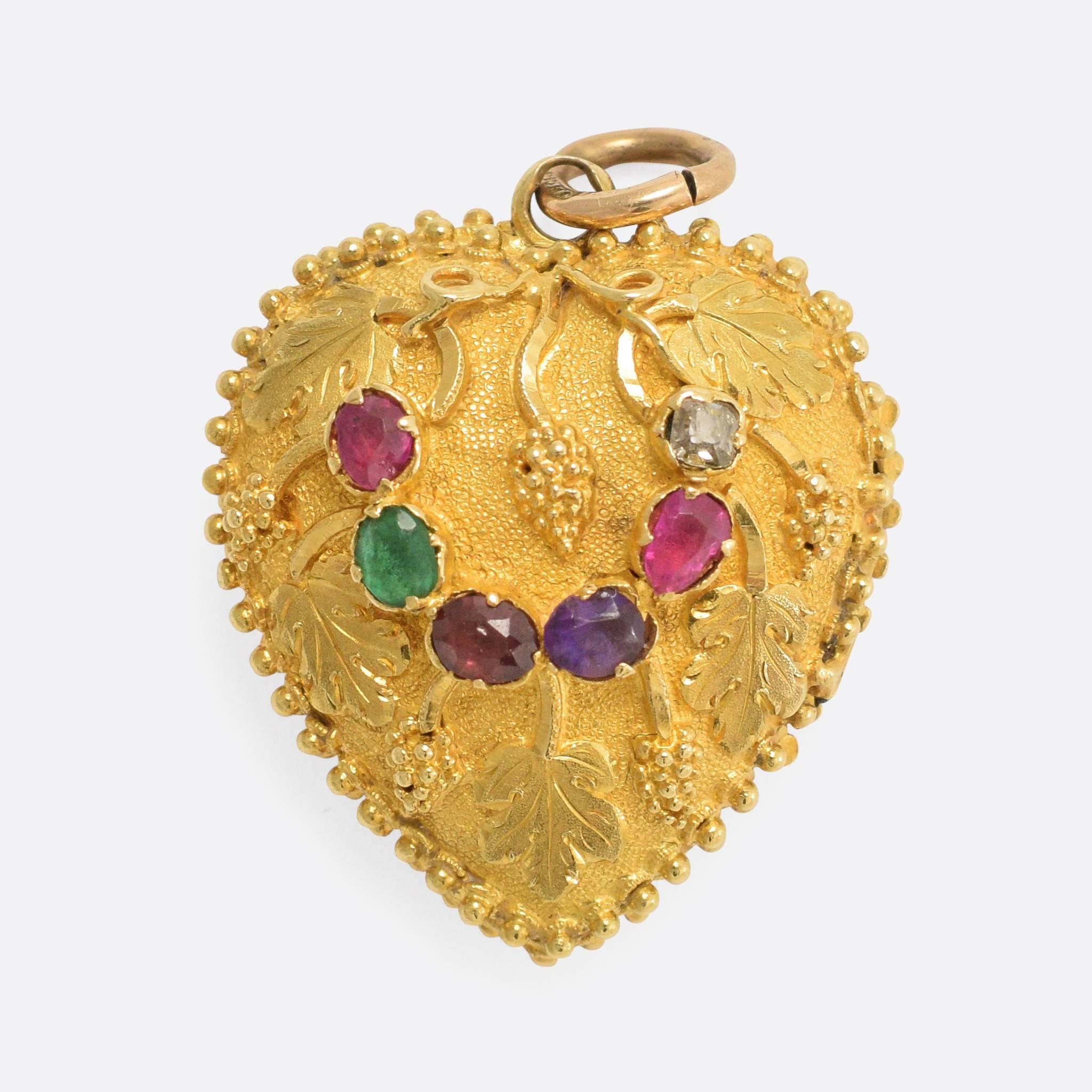 A particularly beautiful antique heart locket, with a gem-set acrostic "Regard" and lovely grape and vine-leaf detailing. The goldwork is superb, with little gold pommels all around the frame - modelled in 18k gold throughout, it dates to