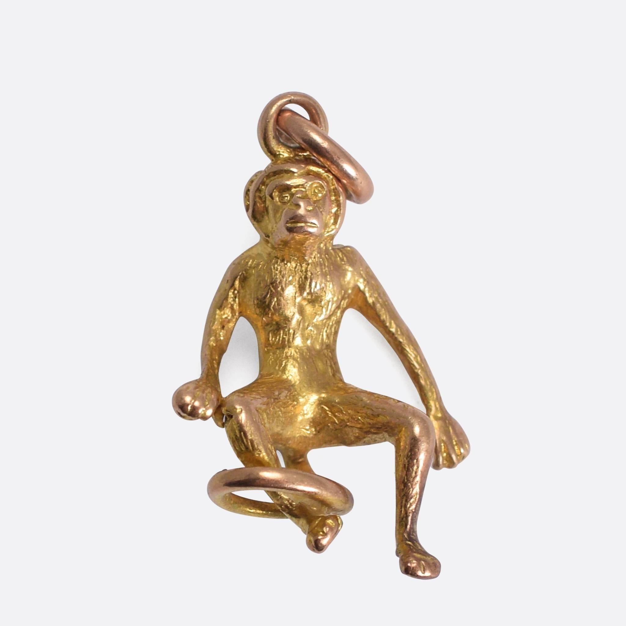 A cute antique monkey charm, modelled in 9k gold. The piece is beautifully detailed, both front and back, with a looped tail.

MEASUREMENTS
2.1 x 1.3cm

WEIGHT
2.6g

MARKS
No marks present, tests as 9k gold