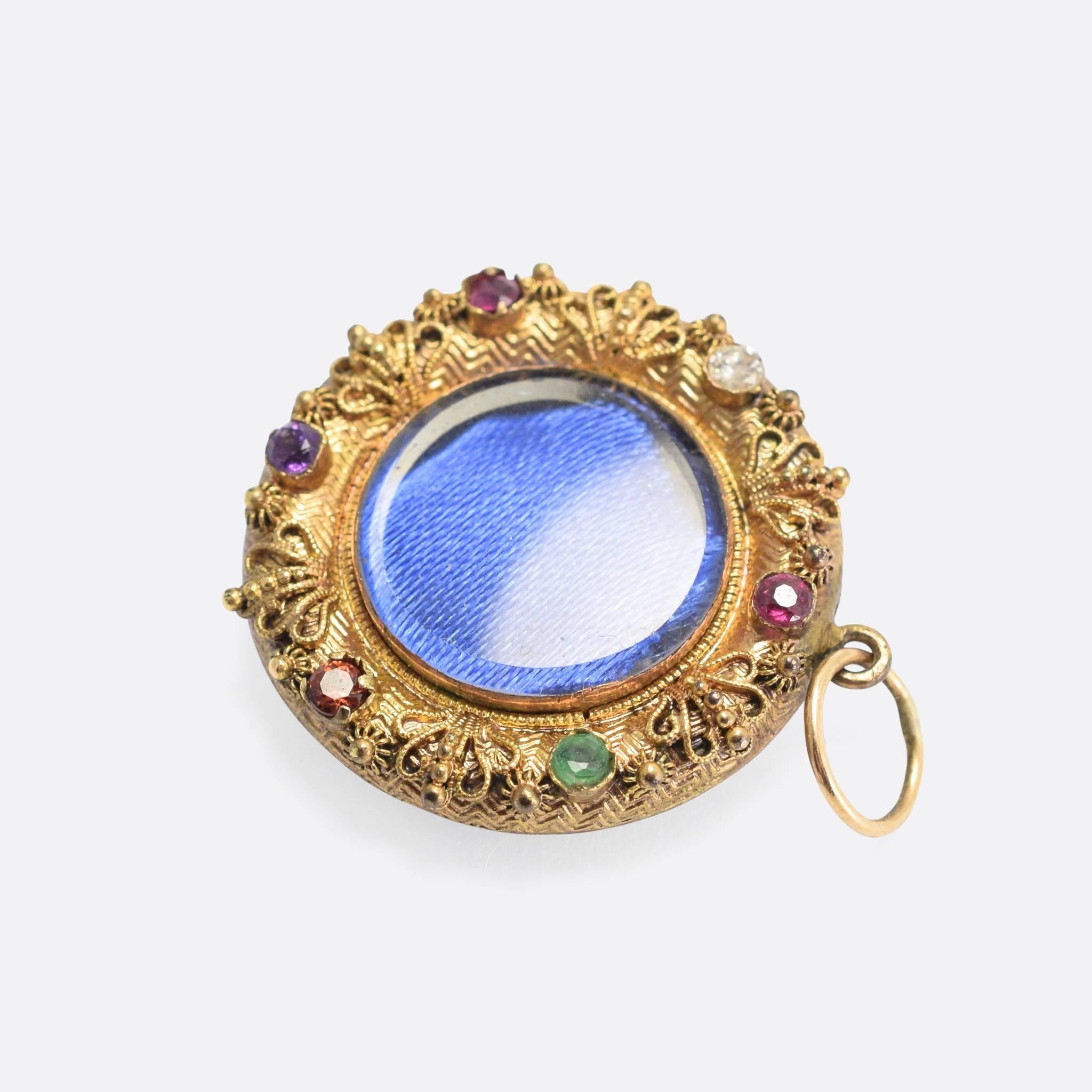 An incredible early 19th Century acrostic locket, dating to the Georgian Regency period. It features wonderfully intricate applied goldwork, with rope and beaded motifs, and superb hand-chased decoration to the front and back.
It's modelled in 15k