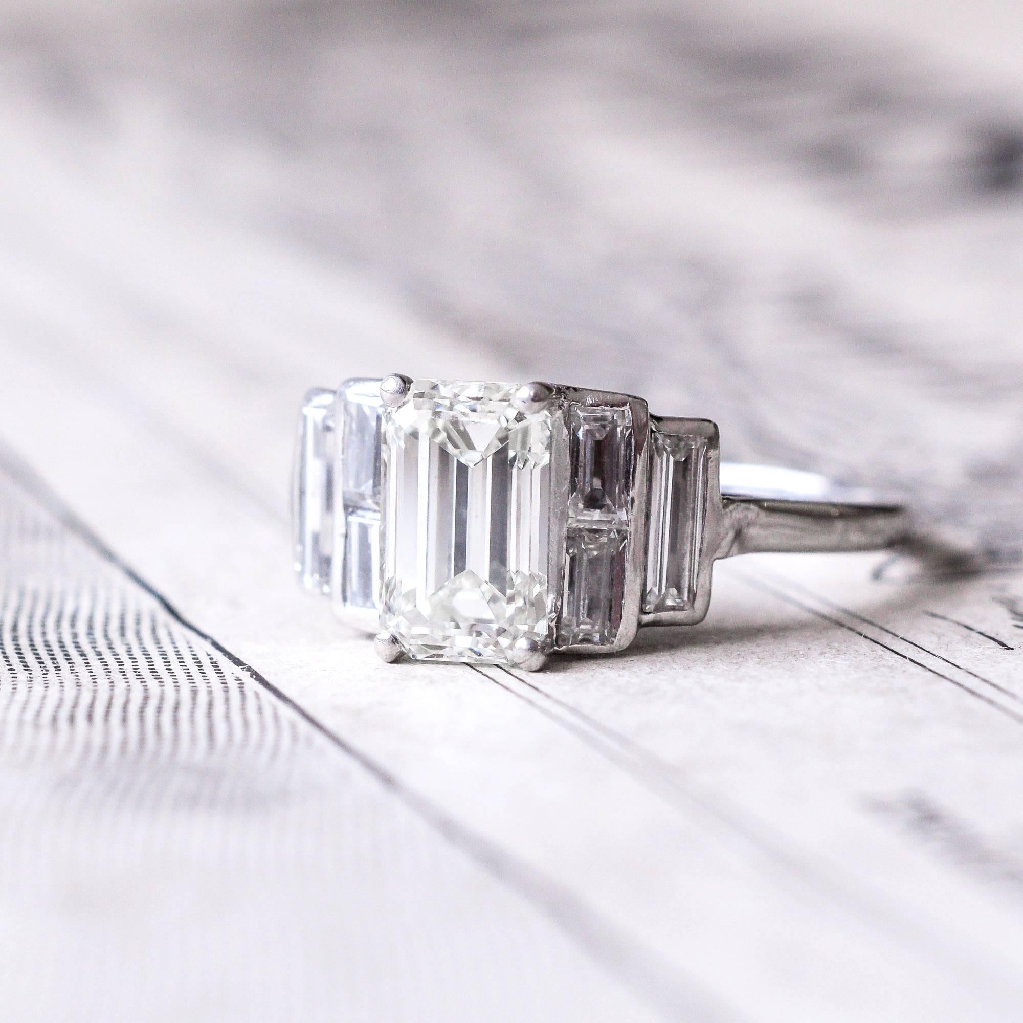 Women's Art Deco 1.35 Carat Emerald Cut Diamond Engagement Ring For Sale