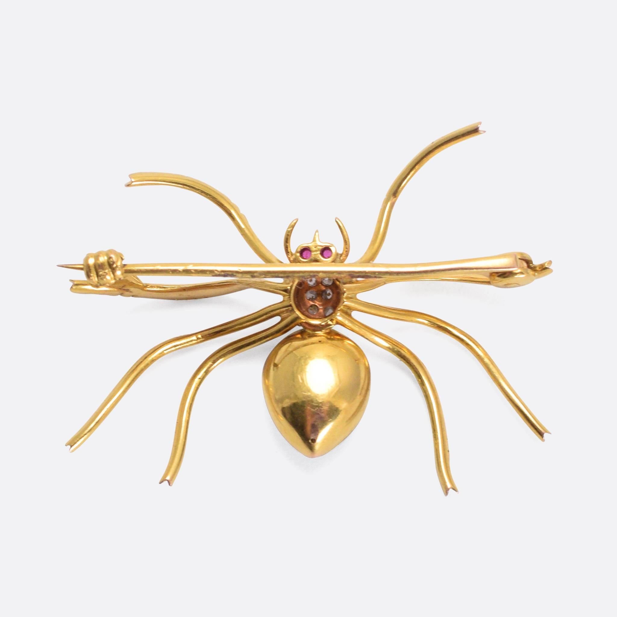A late Victorian spider brooch, finished in vitreous guilloche enamelling and set with diamonds and ruby eyes. It's a good size (3.8cm across), and is finely worked in 15 karat gold.

STONES
Rubies and Diamonds

MEASUREMENTS
3.8 x