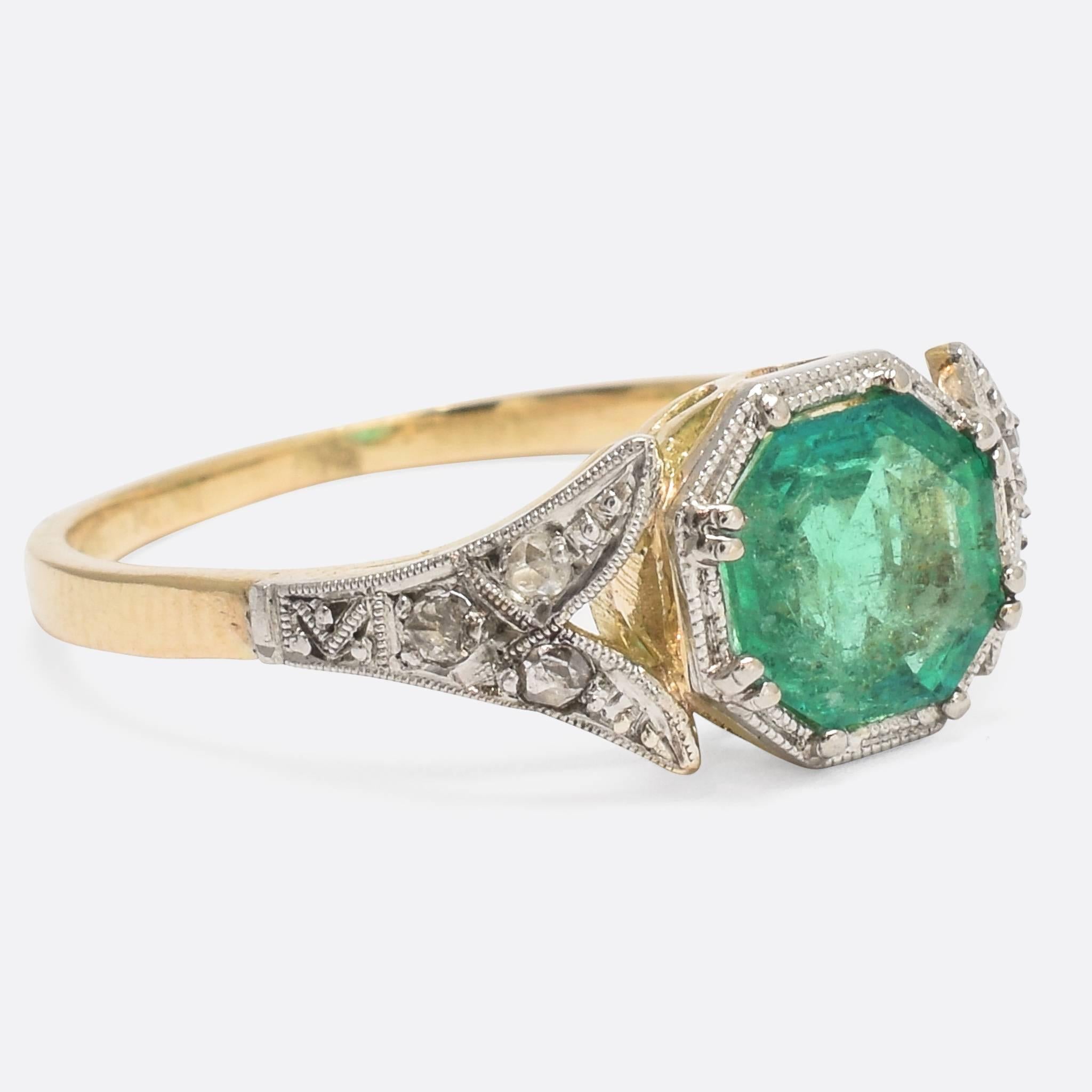 An exceptional early Deco Emerald solitaire ring, with fine millegrain settings and rose cut diamond split shoulders. The principal stone is a stunning Colombian emerald; and octagonal step cut of excellent colour and clarity.
The ring is modelled