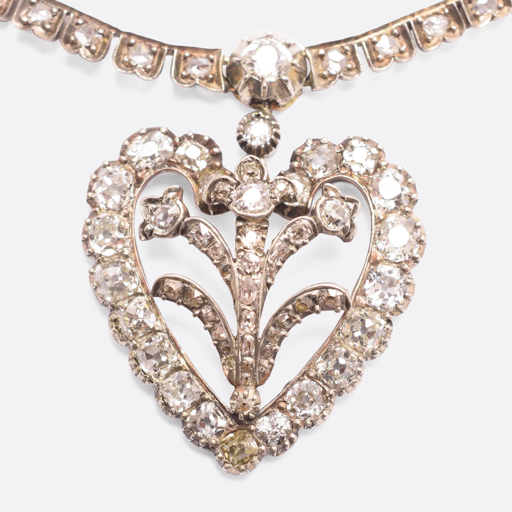 An exceptional antique diamond necklace, with five graduated heart drops. Set with over 30 carats of sparkling old mine cut and rose cut diamonds, the piece is nothing short of spectacular. A true Victorian statement necklace.

STONES
Old Mine Cut