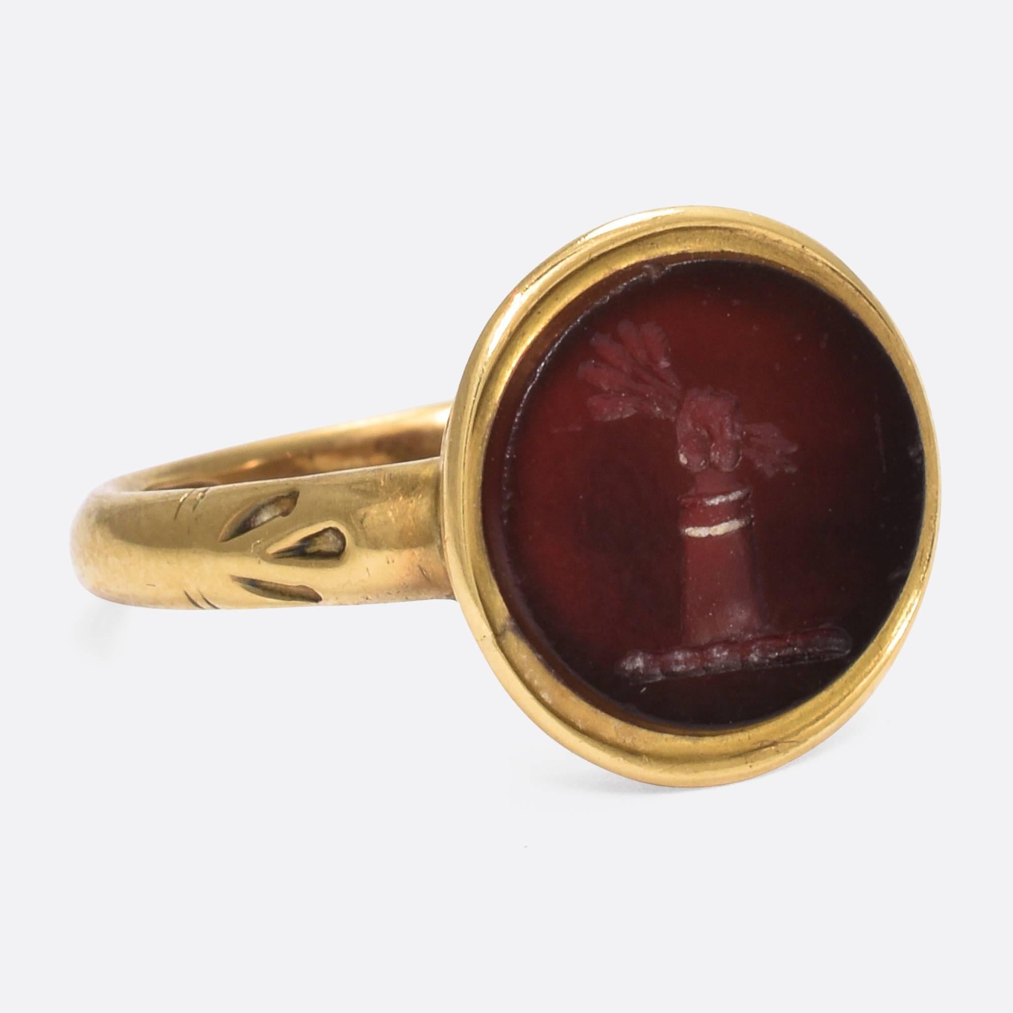 A cool Victorian signet ring made the the highly esteemed jeweller Charles Green & Son. It's modelled in 18k yellow gold, the round carnelian panel carved with an English heraldic crest that, according to Fairbairn, belonged to the Denny, Matcham,