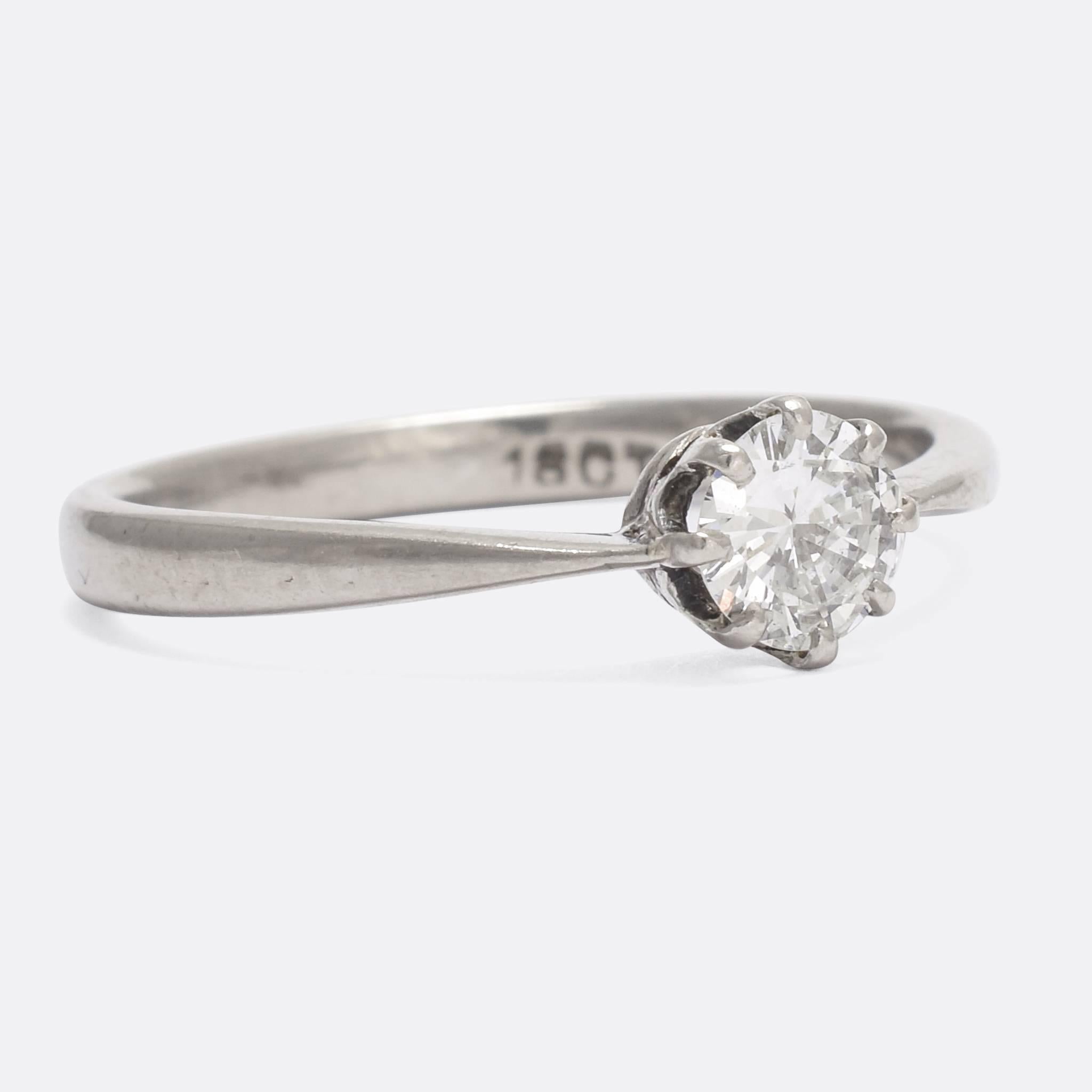 An adorable 1920s diamond solitaire ring, set with a bright .45ct transitional cut stone. The ring itself is modelled in 18k white gold, with elegant pinched shoulders and a classic 8 claw mount.

STONES
0.45 Carat Transitional Cut Diamonds - approx