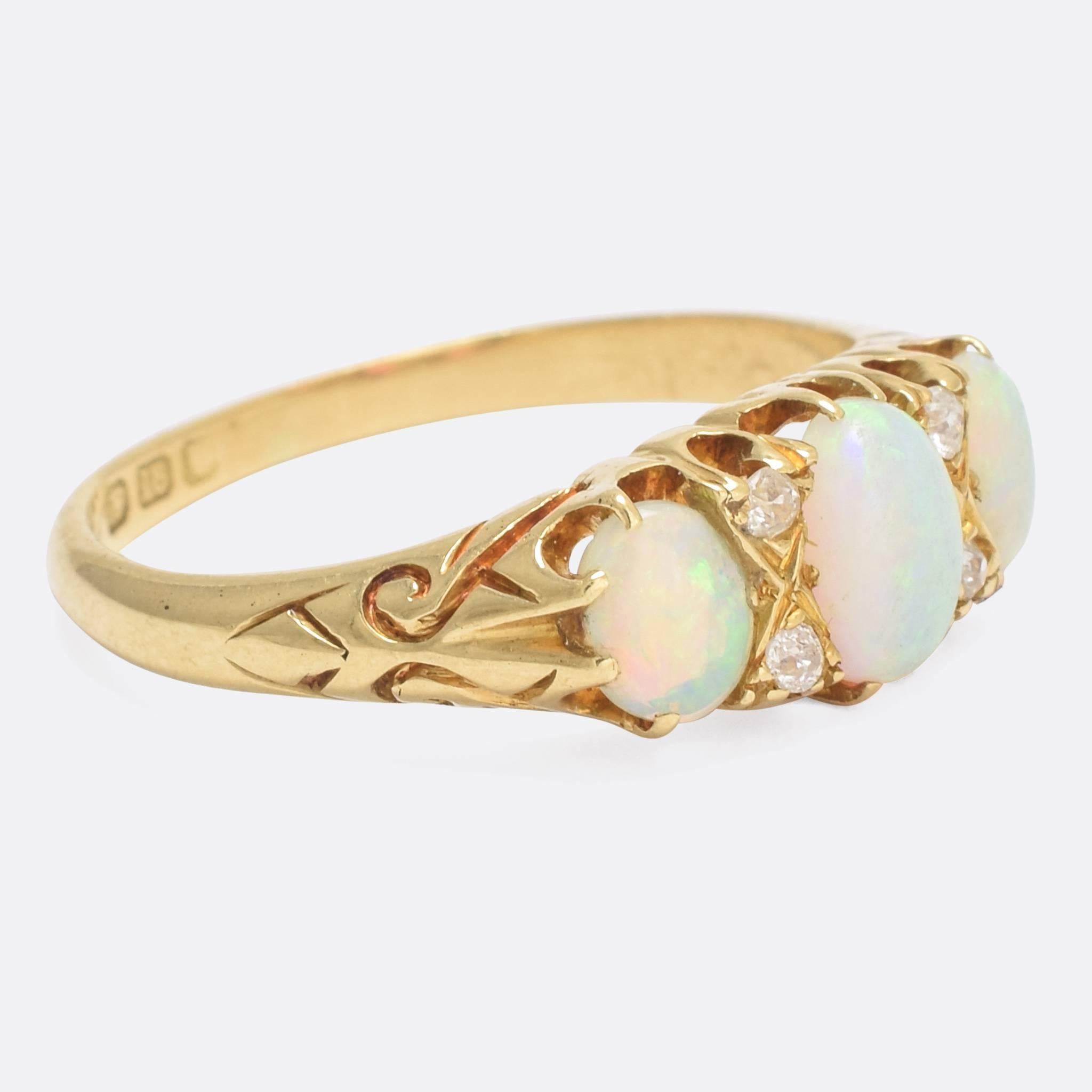 A particularly well formed antique opal and diamond gypsy ring, with deeply chased detailing and elegant fine claw mounts. It's modelled in 18k yellow gold, and dates to the 1880s.

STONES
Natural Opals and Old Mine cut Diamonds

RING SIZE
7.5