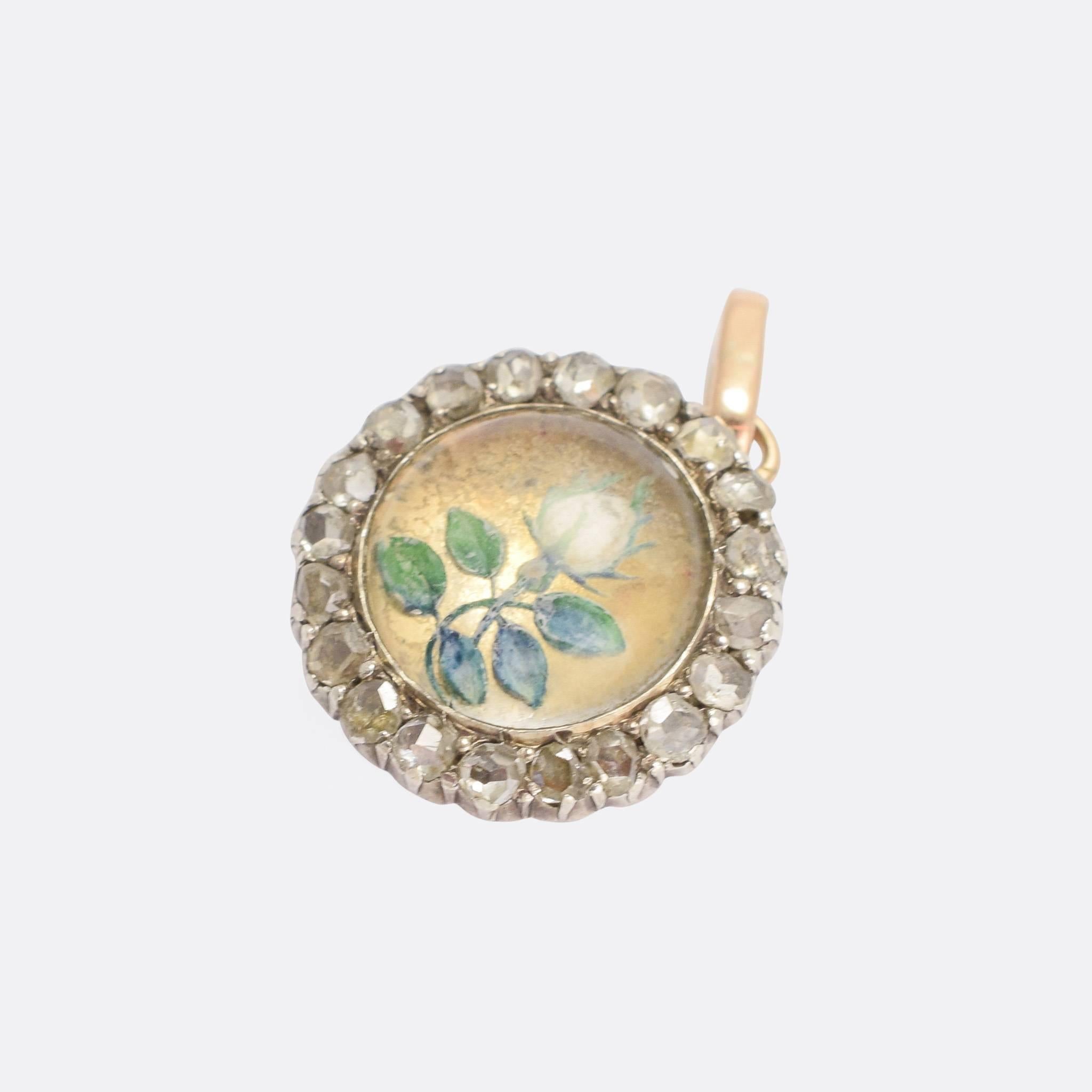 A second antique round locket (see previous post...), this one very different in style. It dates to the mid-Victorain era - circa 1860 - and is set with a reverse carved Essex crystal; the subject is a white rose, delicately hand painted. Around the