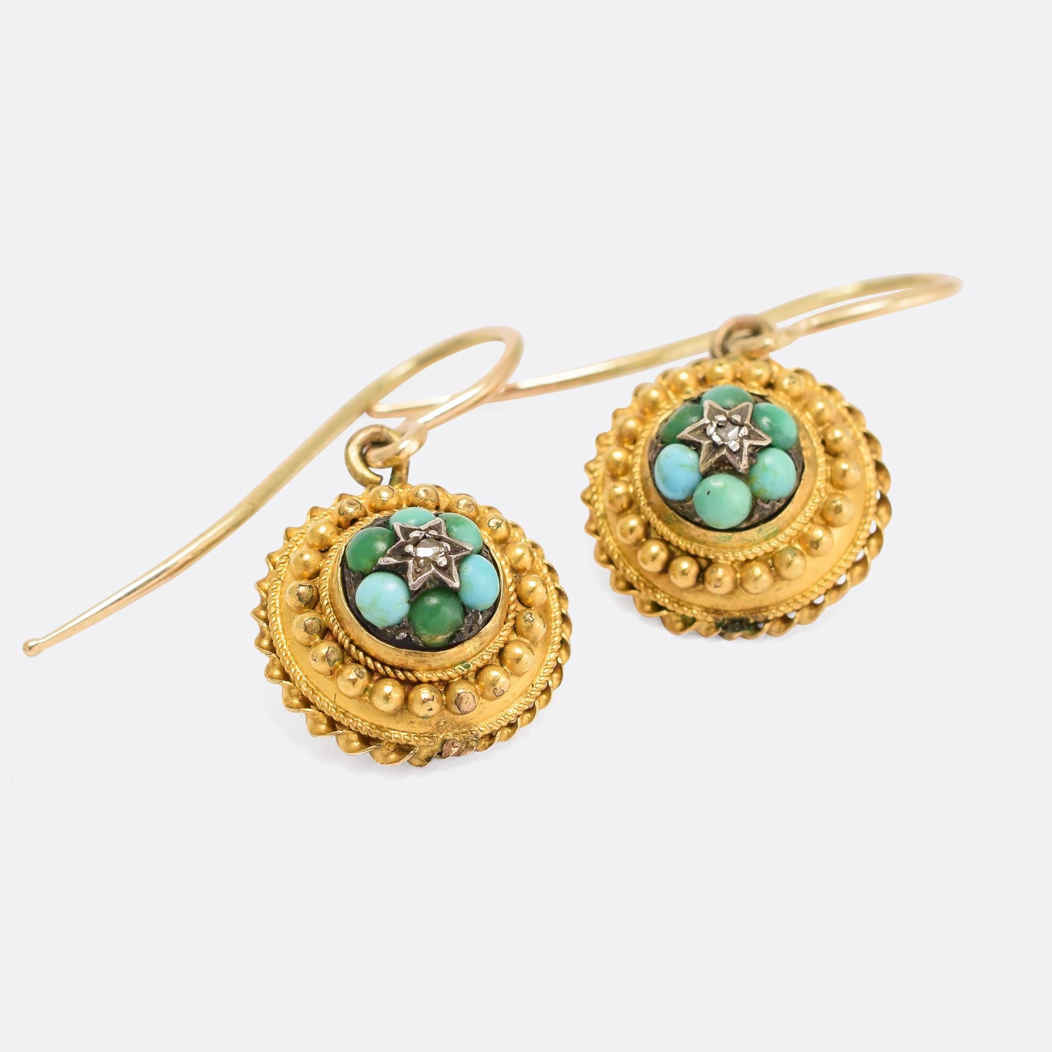 A fine example of antique Etruscan Revival jewellery, these earrings date from the 1870s - each one set with six turquoise cabochons and a central rose cut diamonds. They features excellent Etruscan goldwork: applied ropework and pomels, gold twist