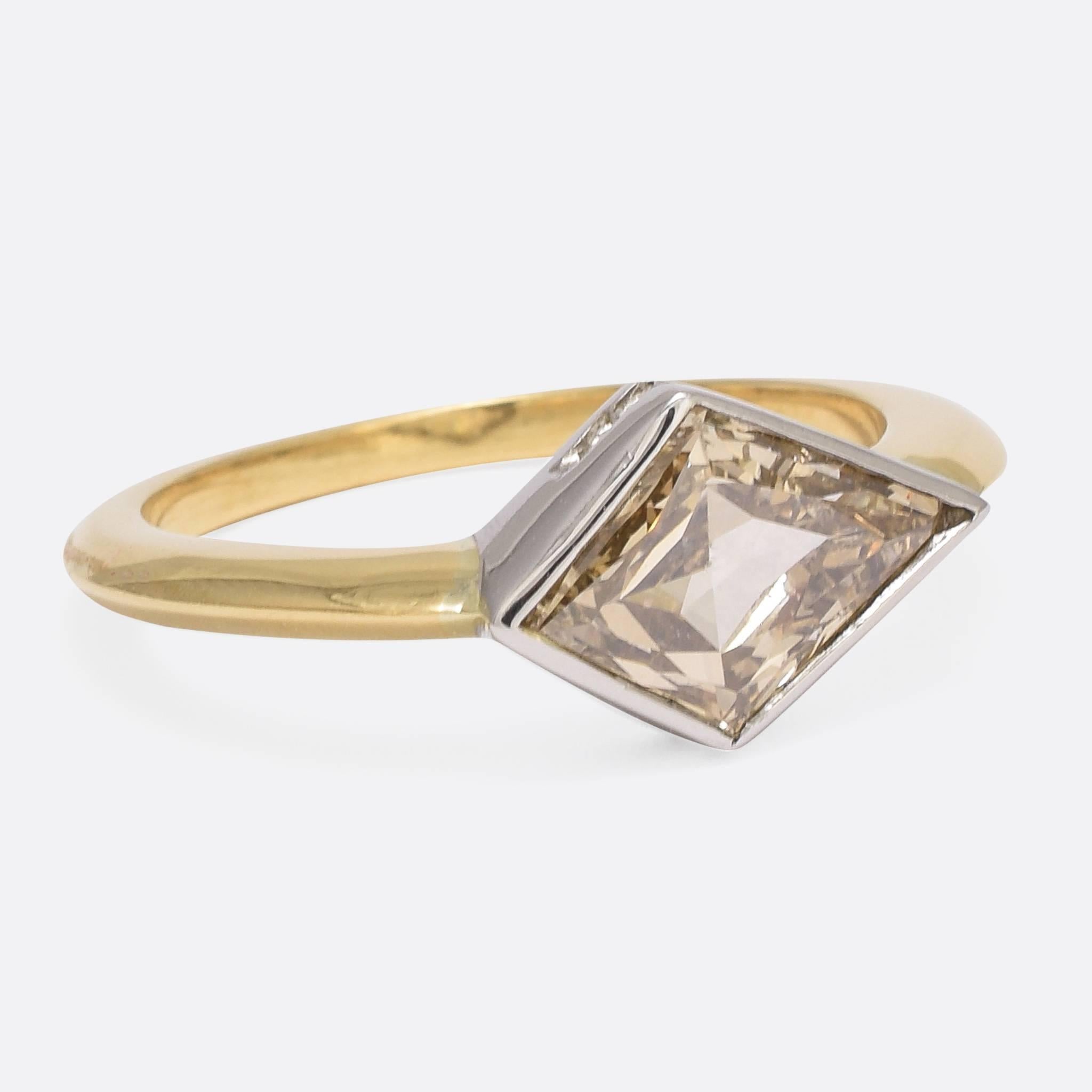 We have set a superb kite shaped diamond in a contemporary ring mount of our own design. The knife-edge band is modelled in recycled 18ct yellow gold, and the 1.91ct stone lies in a simple platinum collet setting. The diamond has a beautiful