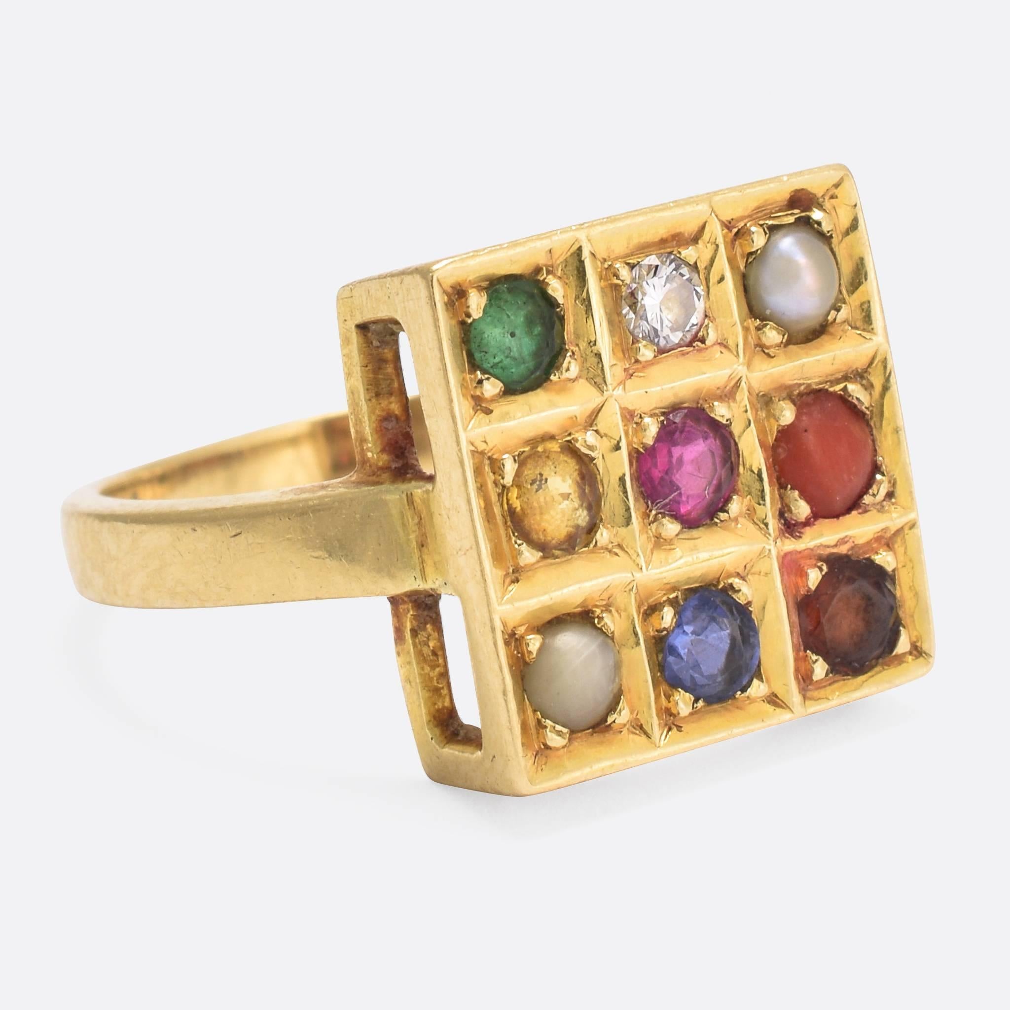 A wonderful vintage Navaratna ring, modelled in 18k gold and dating to the 1950s. Navaratna jewellery is always set with nine stones, each one represents a different celestial body from our solar system. Late Thai astrologer Horacharn Thep