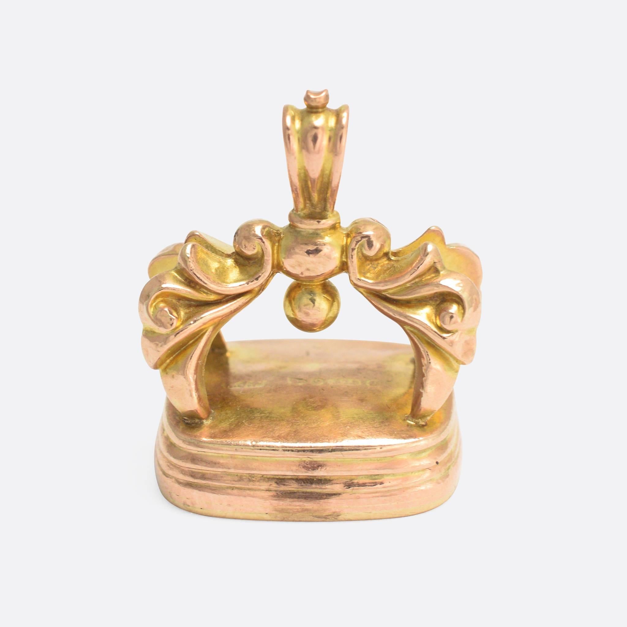 An impressive Victorian seal fob, modelled in 9k rose gold and dating to 1886. It's a good big size, and the base has been carved with a shield-shaped armorial crest. The frame features lavish foliate detailing, very typical of the mid-Victorian