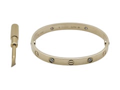 Bracciale Cartier Love, modello classico, oro giallo 18 carati, 4 diamanti, misura 16