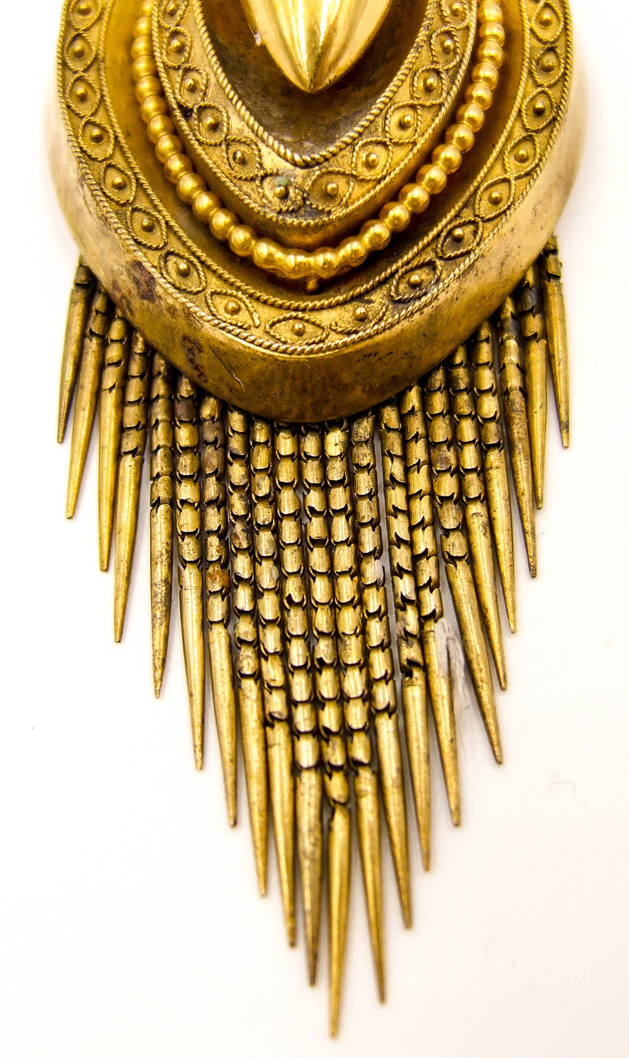 Victorian elegance in a stylish granulation adorned pendant.  The rear compartment houses two locks of different colored curls of hair, and the front boasts a graduated, handmade fringe of gold.