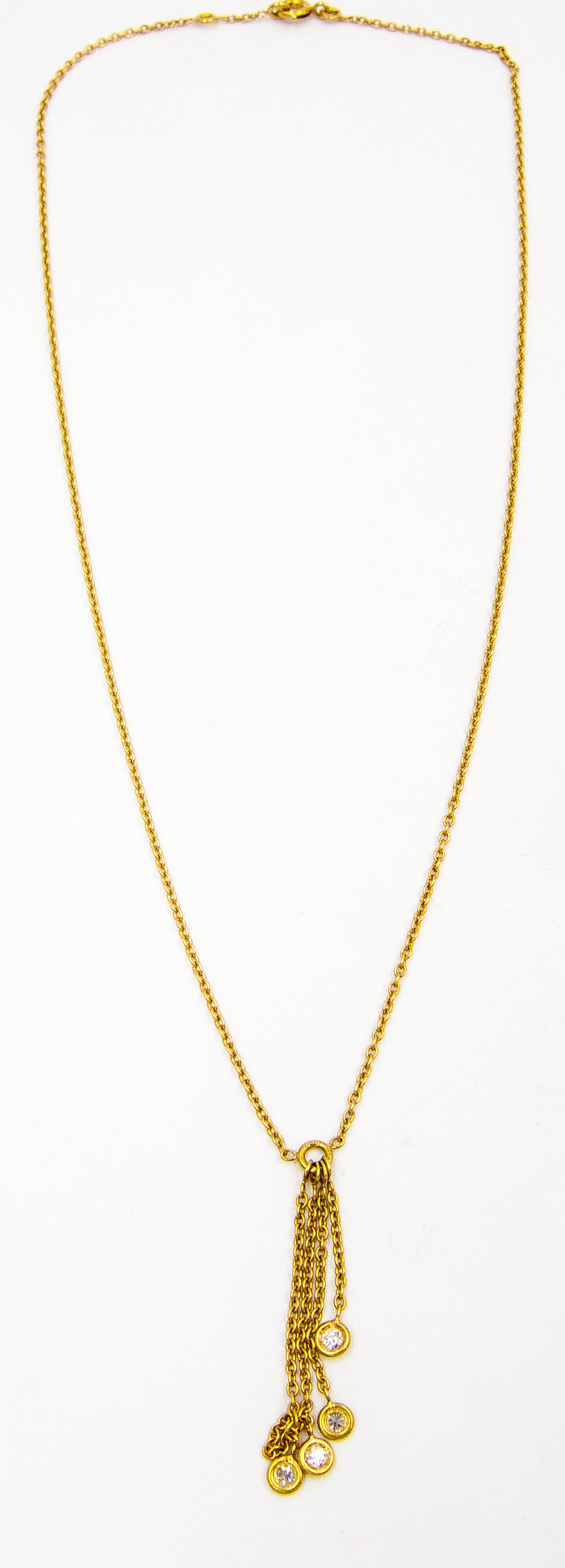Adorable 18 karat yellow gold and diamond necklace, signed Dior.   The chain measures 15