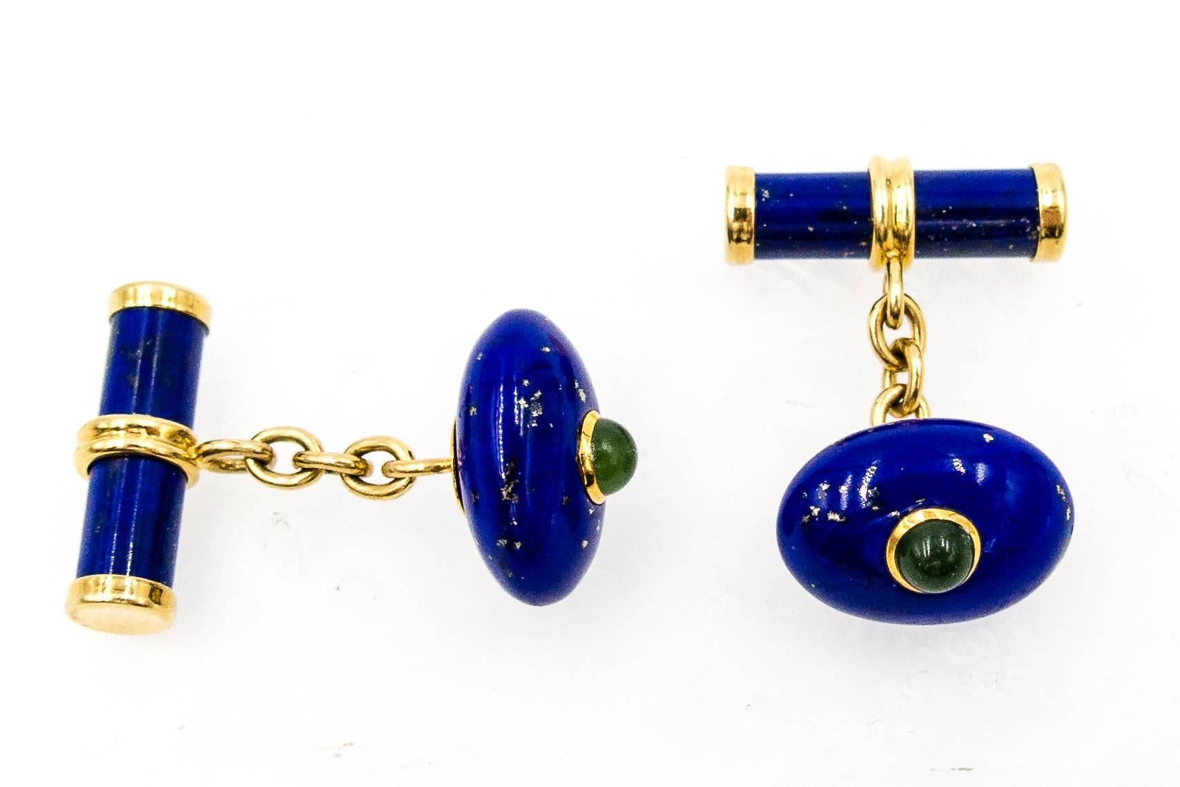 Beautifully crafted and wearable lapis cufflinks topped with a cabochon of nephrite jade.   Set in heavy 18 karat highly polished yellow gold, the deep and rich blue of the lapis shows flecks of hematite throughout.   Marked 