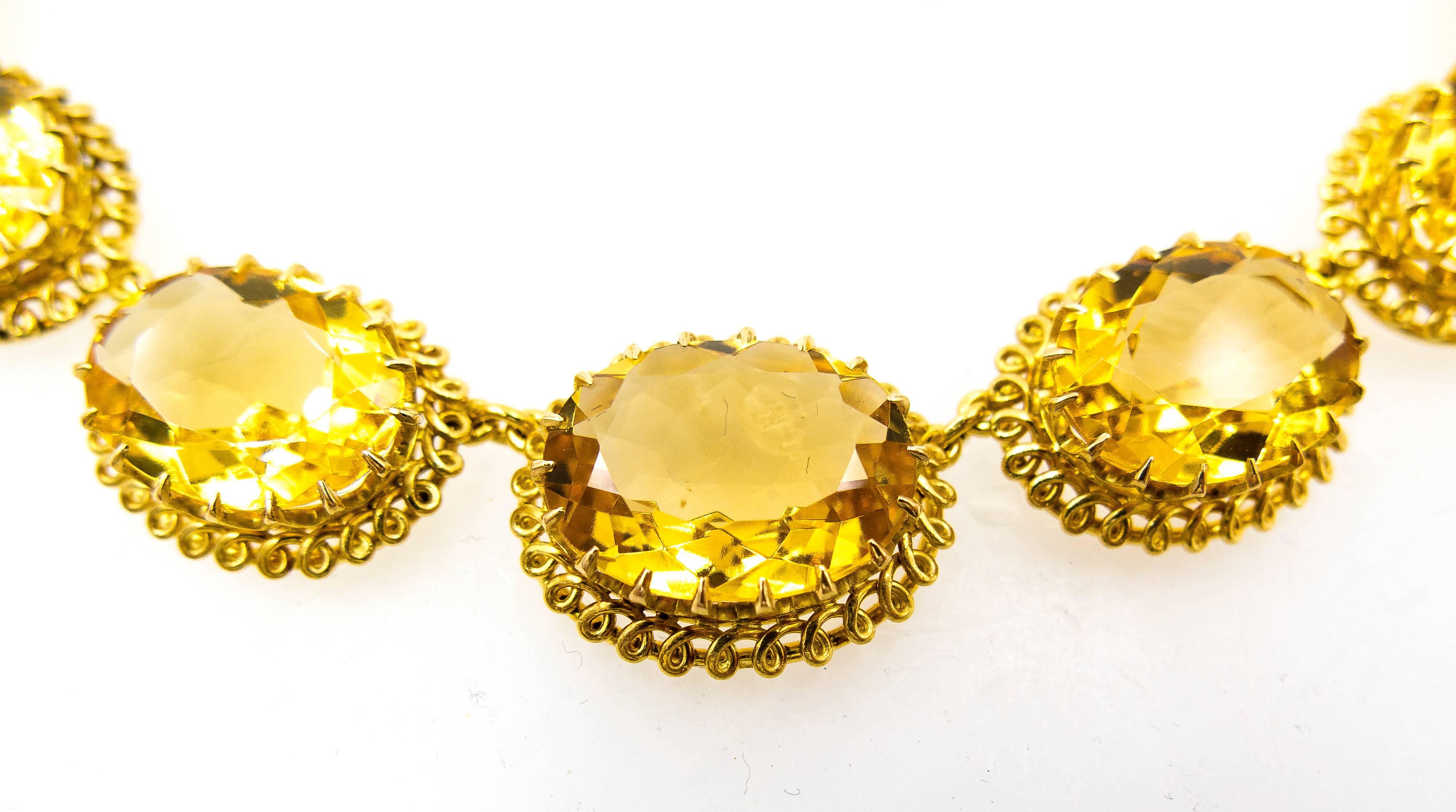 This delightful suite is like wearing a piece of the sun at the ears and around the neck.   The mount is hand crafted, each curl of gold hand-turned, and is hallmarked with Portugese marks for 19 carat gold, and would be difficult and costly to