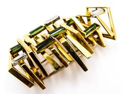 Andrew Grima Alfiler de oro con turmalina baguette y diamantes