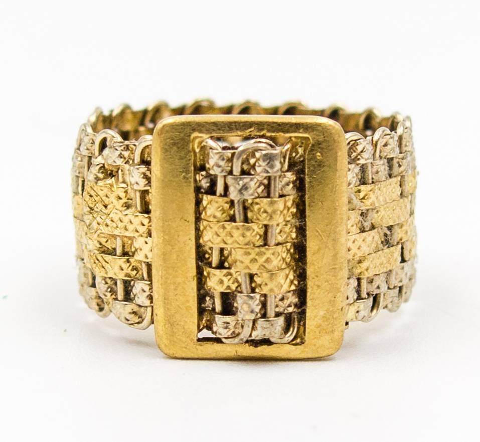 An easy to wear band ring with serious eye appeal due to the texturing of the woven gold and the contrast between the white gold and the yellow gold,   Size 7, stamped 