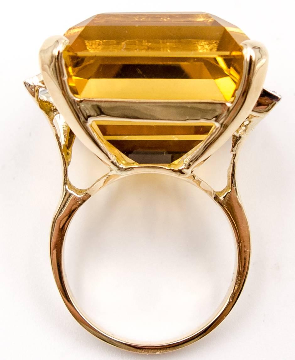 Impress friends and business associates with this postwar citrine and diamond cocktail ring that, when worn on the finger, measures 1