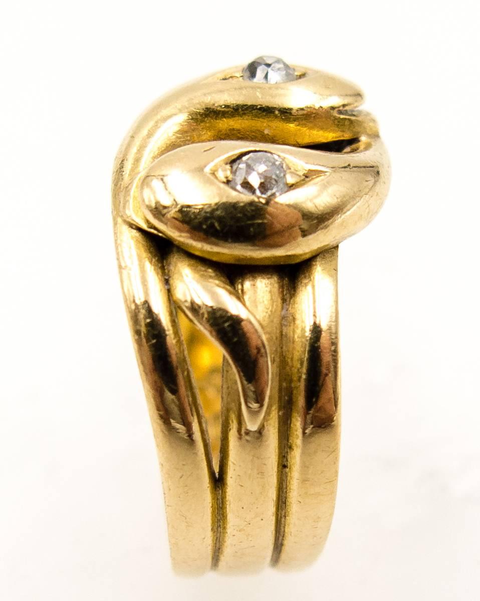 A superbly wearable Victorian snake ring mounted in 18kt yellow gold. It's currently a size 6 3/4, but can be sized up or down; please be aware that sizing will affect the English hallmarks on the inner shanks, which state that the ring was