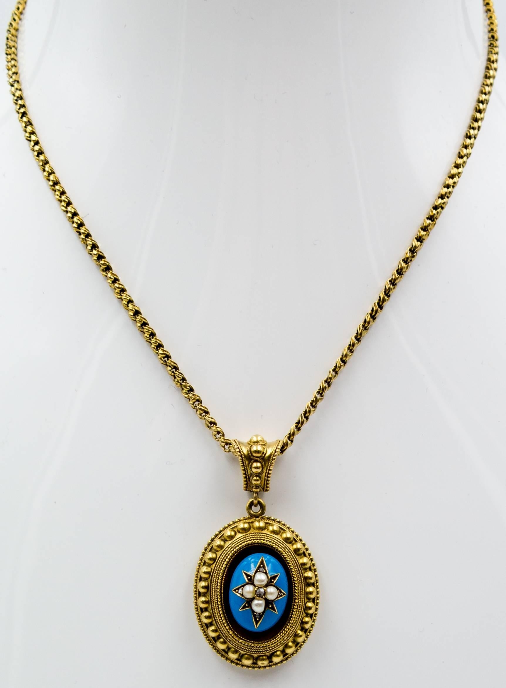 A slice of the Victorian era with this lovely robin's egg blue enamel and split pearl oval pendant adorned with intricate gold wirework and granulation.  The pendant alone is 15 karat yellow gold, and measures 1 3/4 inches by 1 1/8 inches, and the